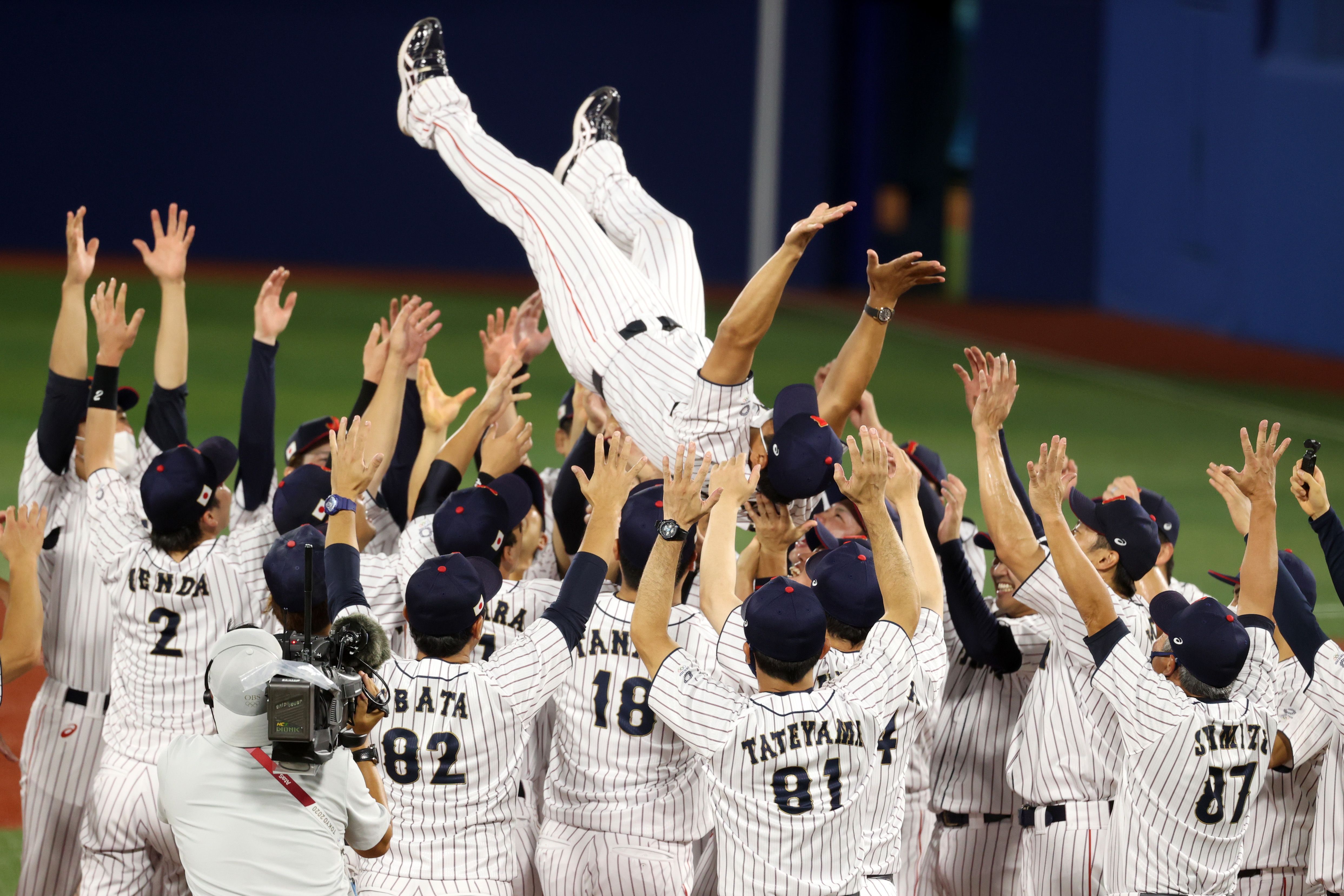 japan baseball team celebrating gold medal win