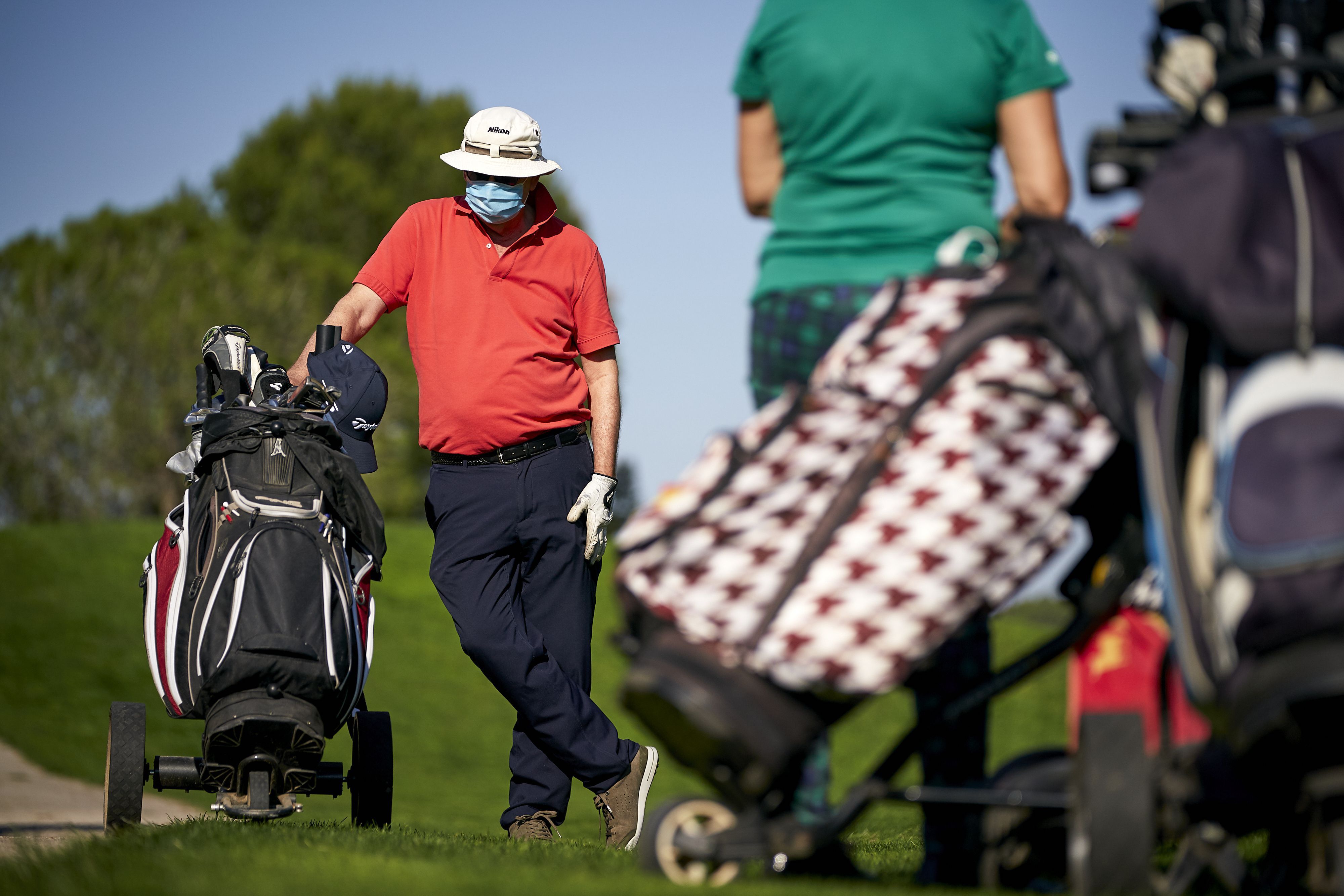 Golfers with pushcarts