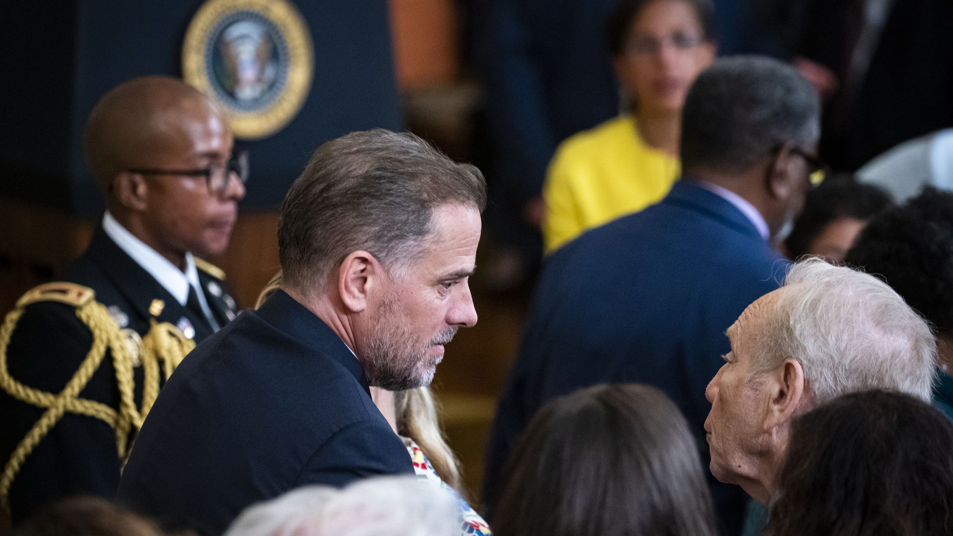 Former Sen. Joe Lieberman right, speaks with Hunter Biden, son of President Biden, on July 7, 2022.