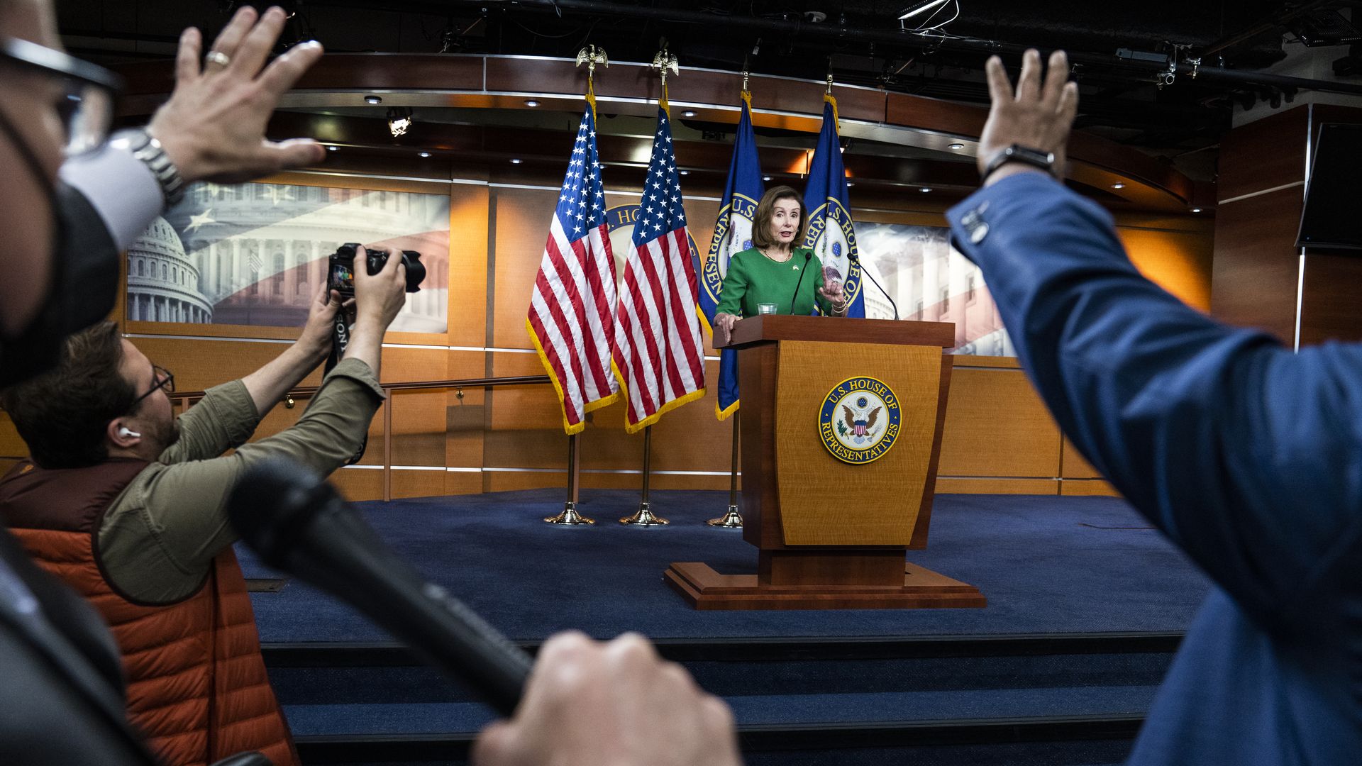 House Speaker Nancy Pelosi is seen answering questions during her weekly news conference.
