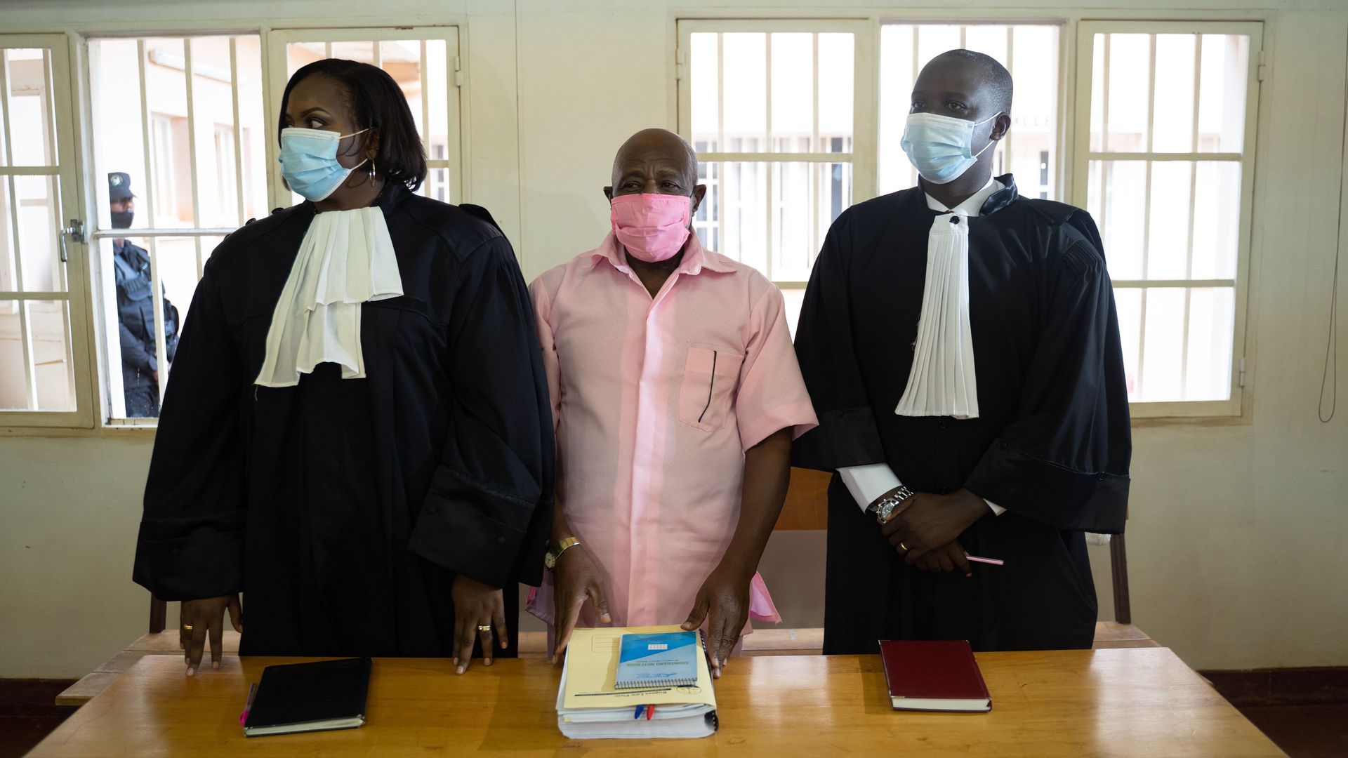 The hero of "Hotel Rwanda" is seen during his trial.