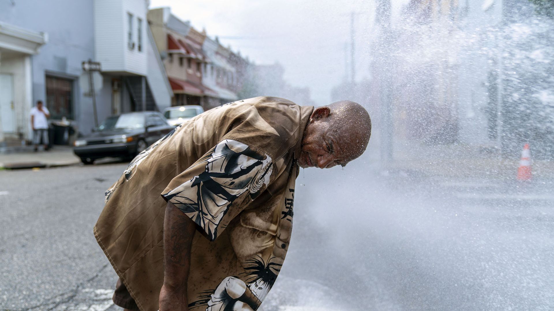 Eduardo Velev cools off in the spray of a fire hydrant during a heatwave on July 1, 2018 in Philadelphia.