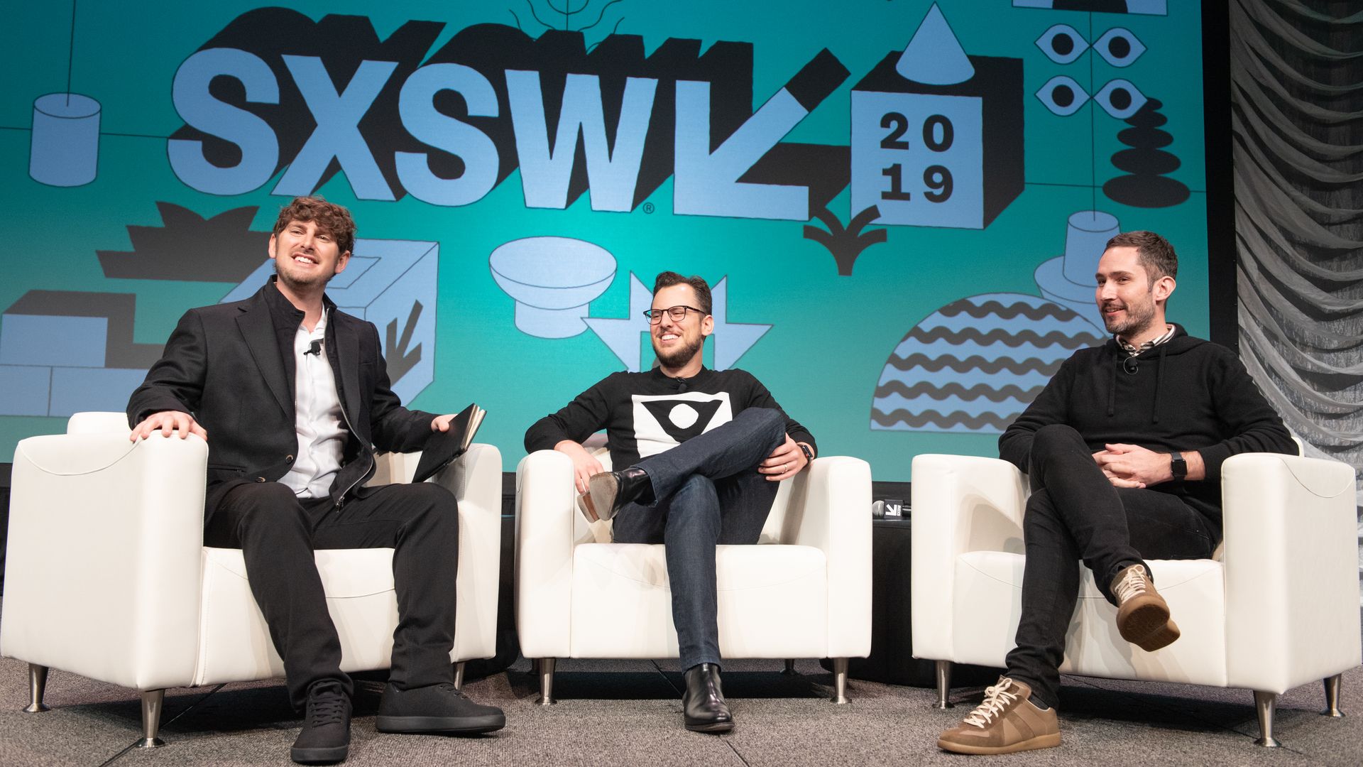 Tech Crunch editor-at-large Josh Constine (L) interviews Instagram co-founders Mike Krieger (C) and Kevin Systrom live on stage during the 2019 SXSW Conference 