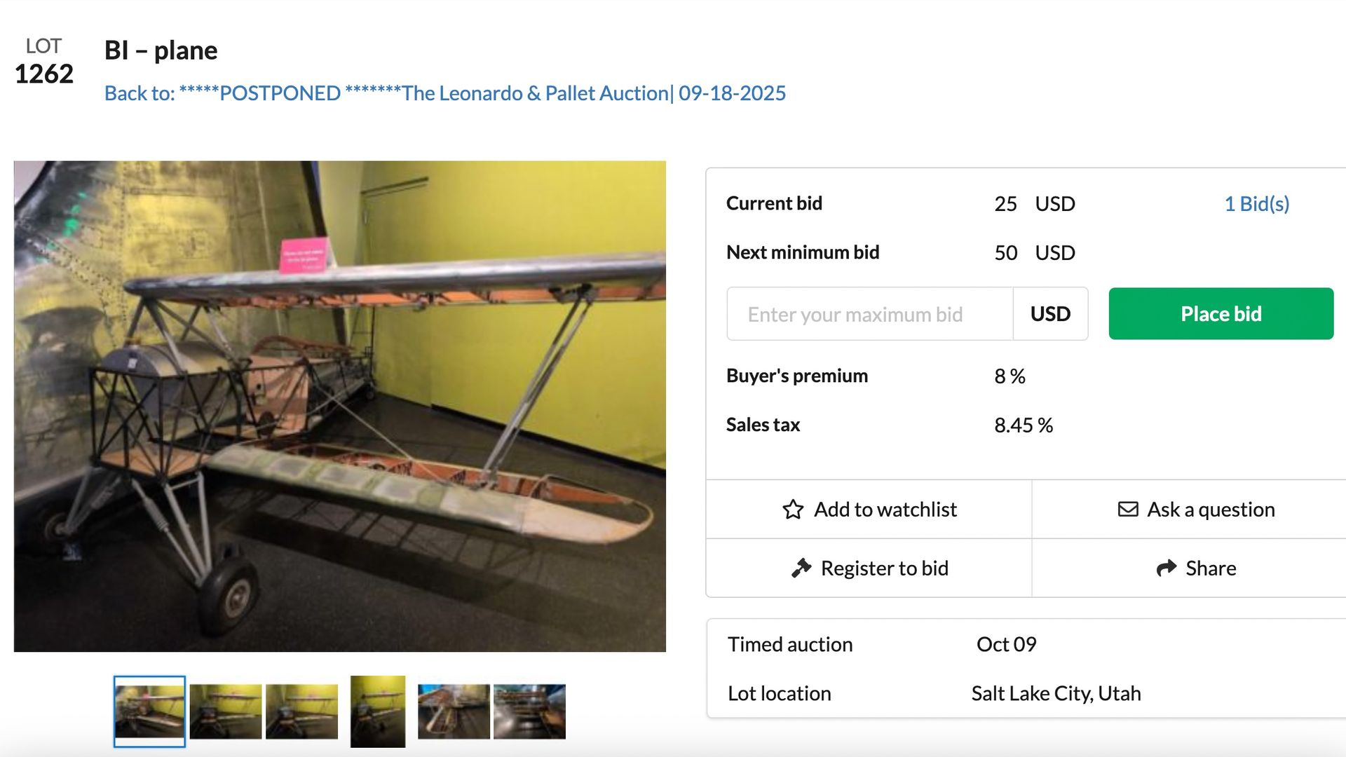 An auction listing for a bi-plane, with a minimum bid of $50.