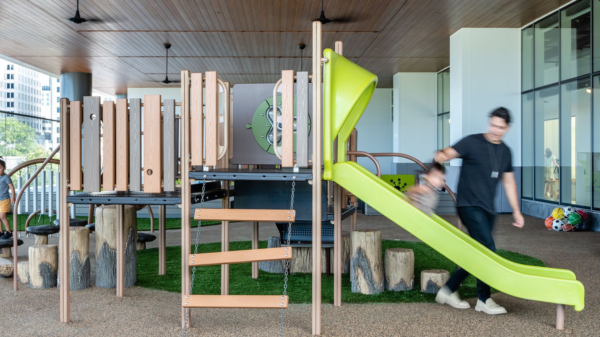 A child goes down the slide at the Marriott headquarters' child care center.