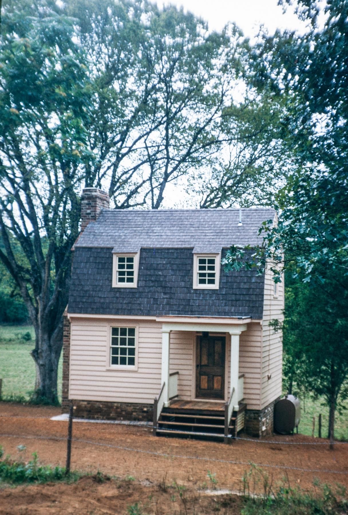 an old house with white siding 