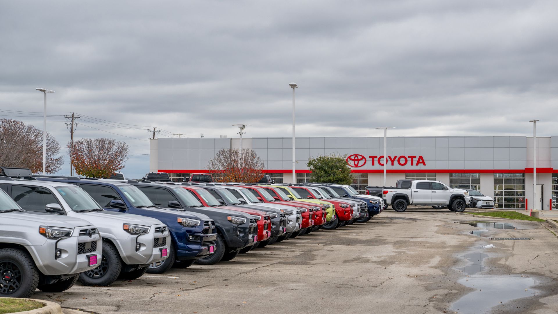 A photo of cars parked at a Toyota dealership