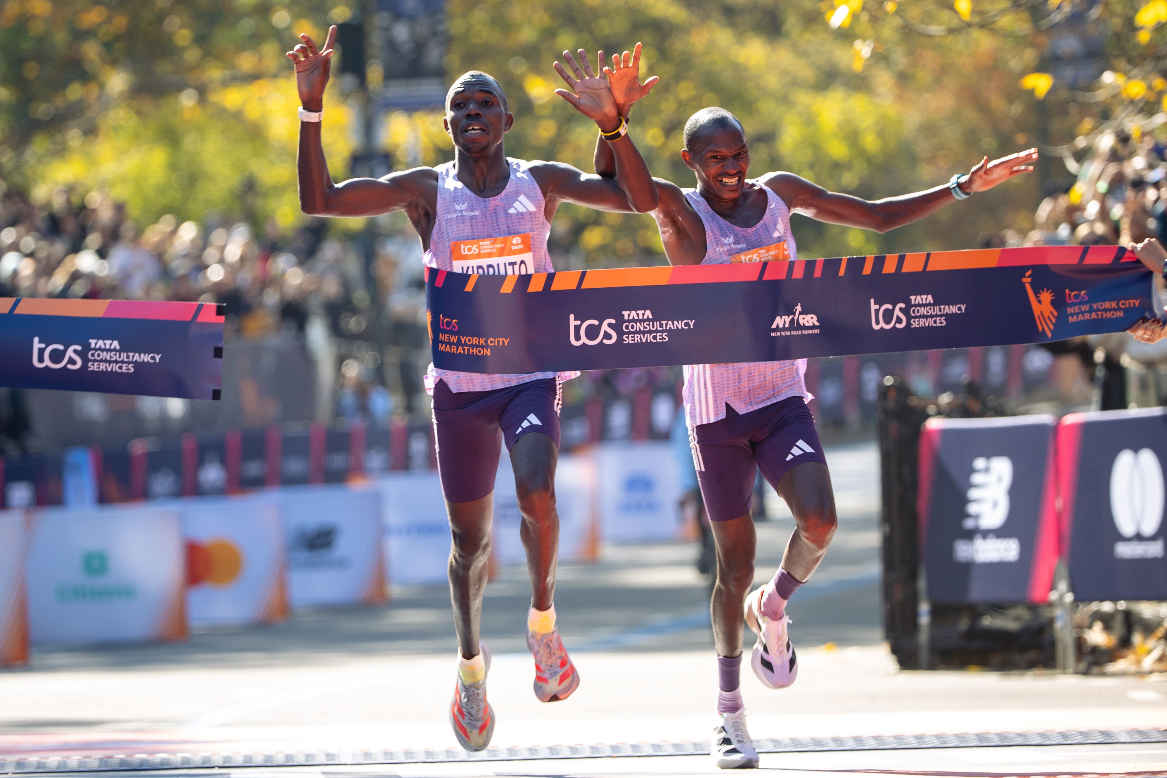 Benson Kipruto and Alexander Mutiso cross the finish line to finish first and second in the New York City Marathon yesterday. 