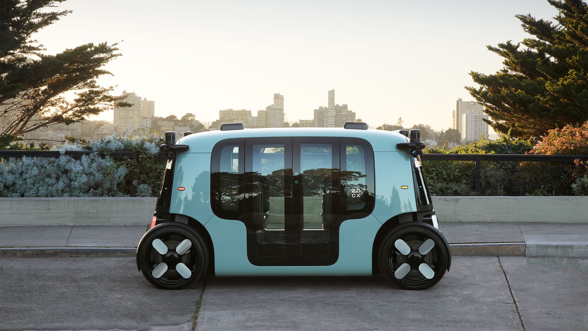 Image of Zoox robotaxi, which looks like a toaster on wheels