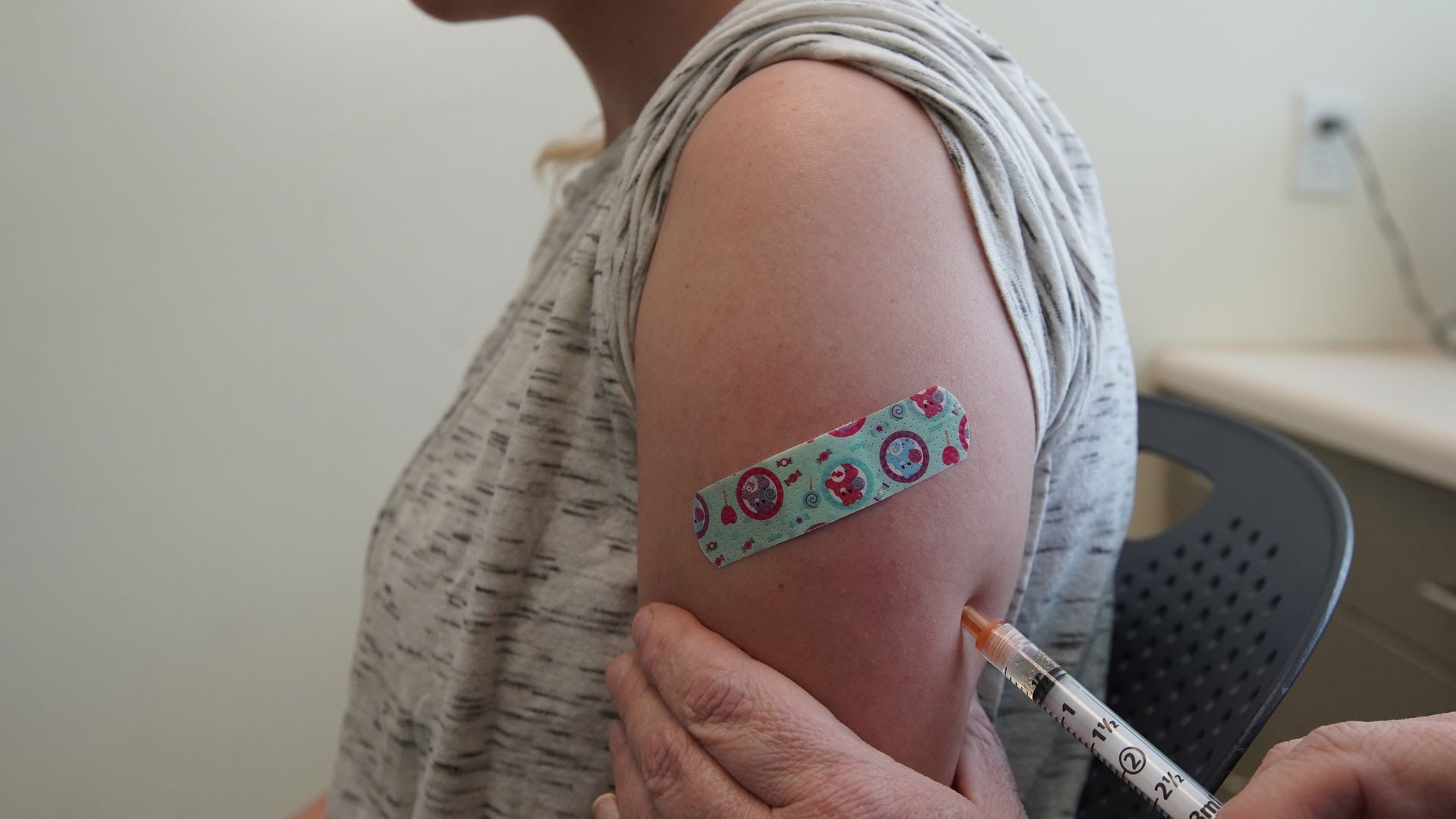a person getting their measles shot