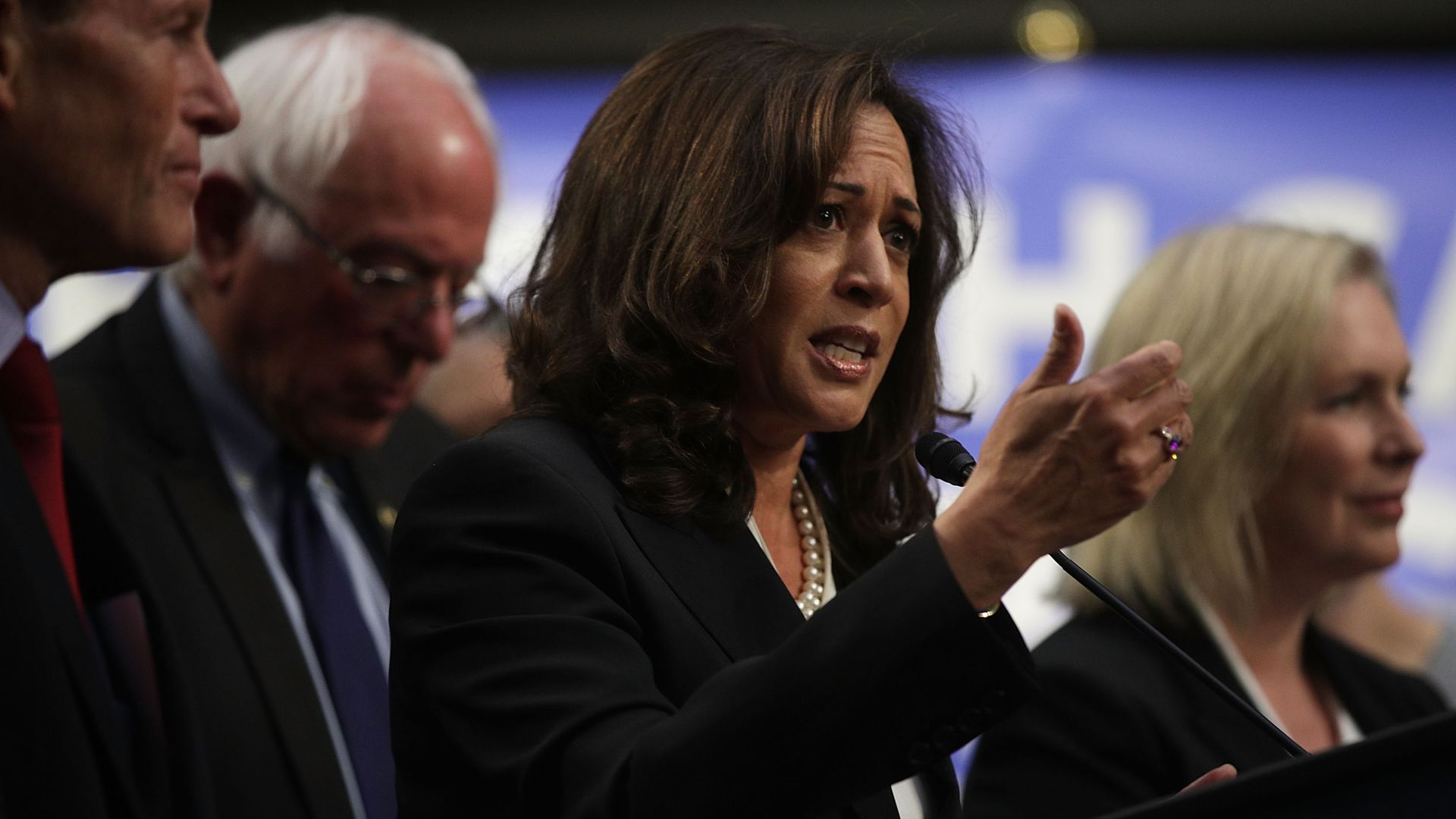 Kamala HArris at podium for medicare for all bill