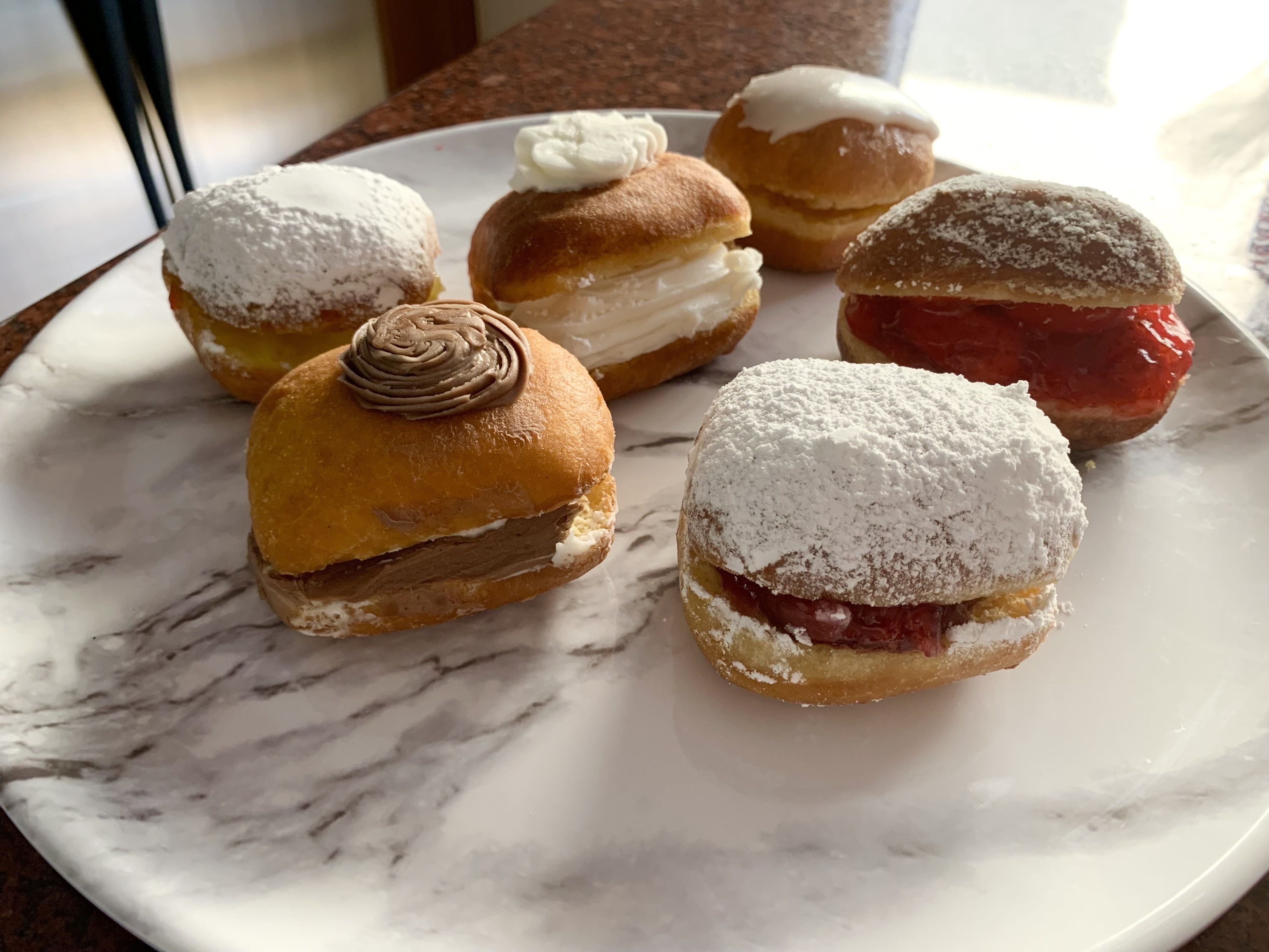 Photo of Paczkis on a plate. 