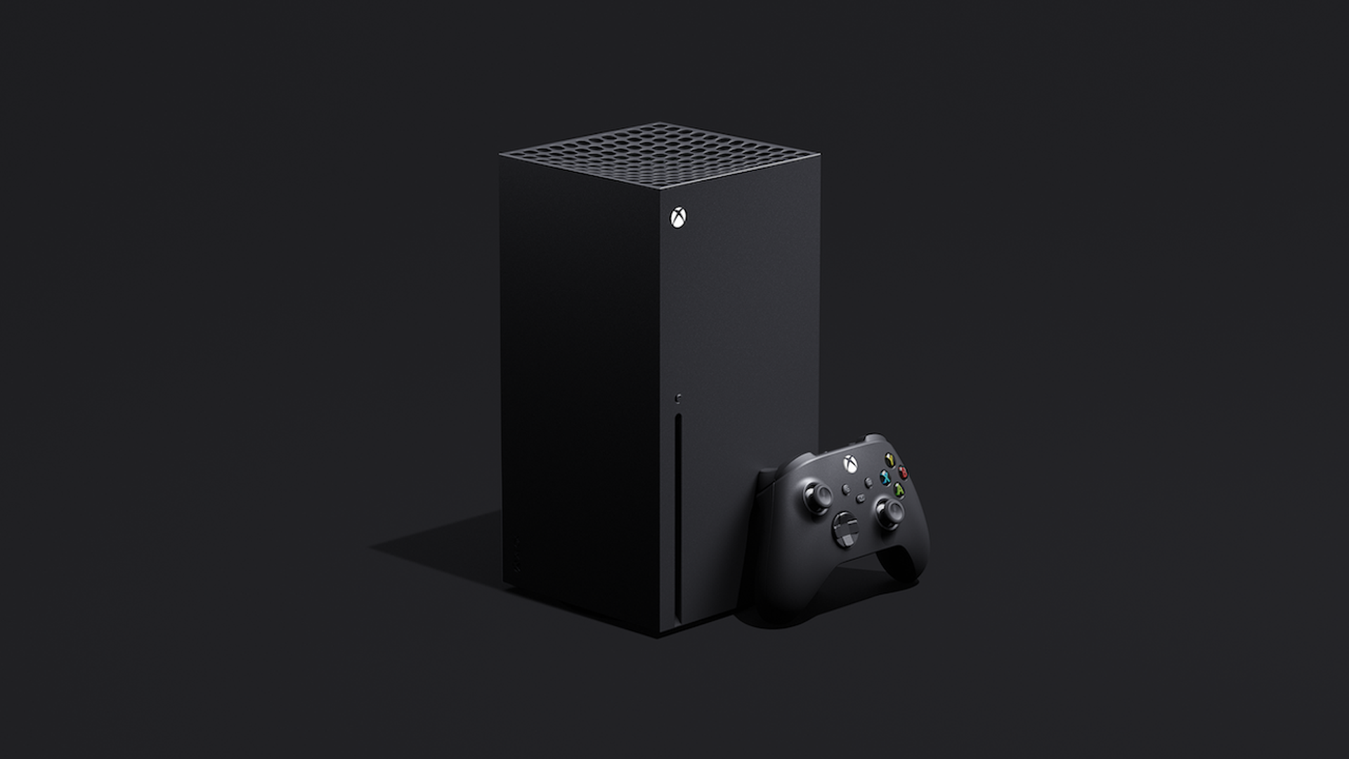 Image of a black Xbox console and controller in front of a black backdrop