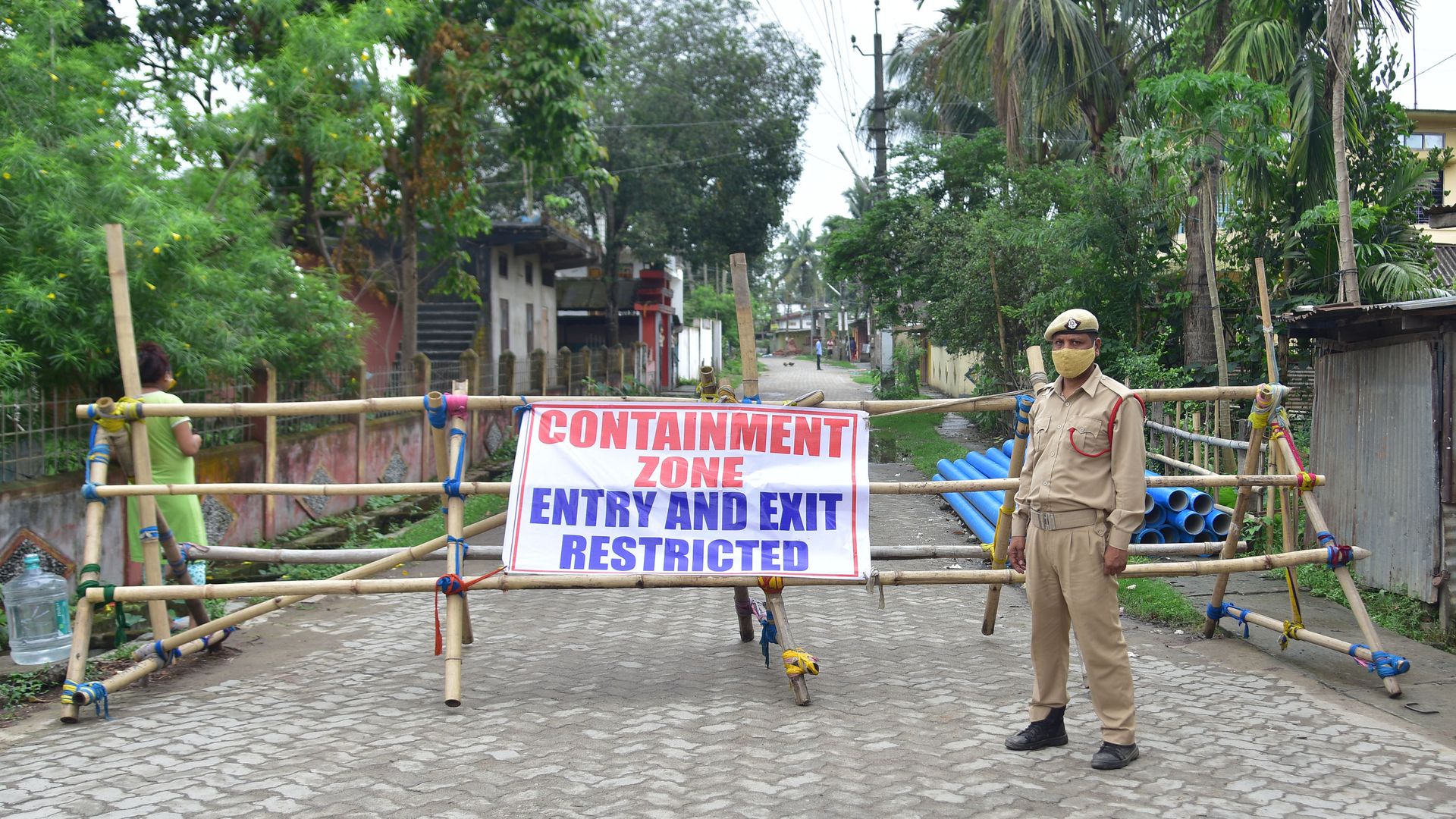 Picture of a sign that says "containment zone" in India