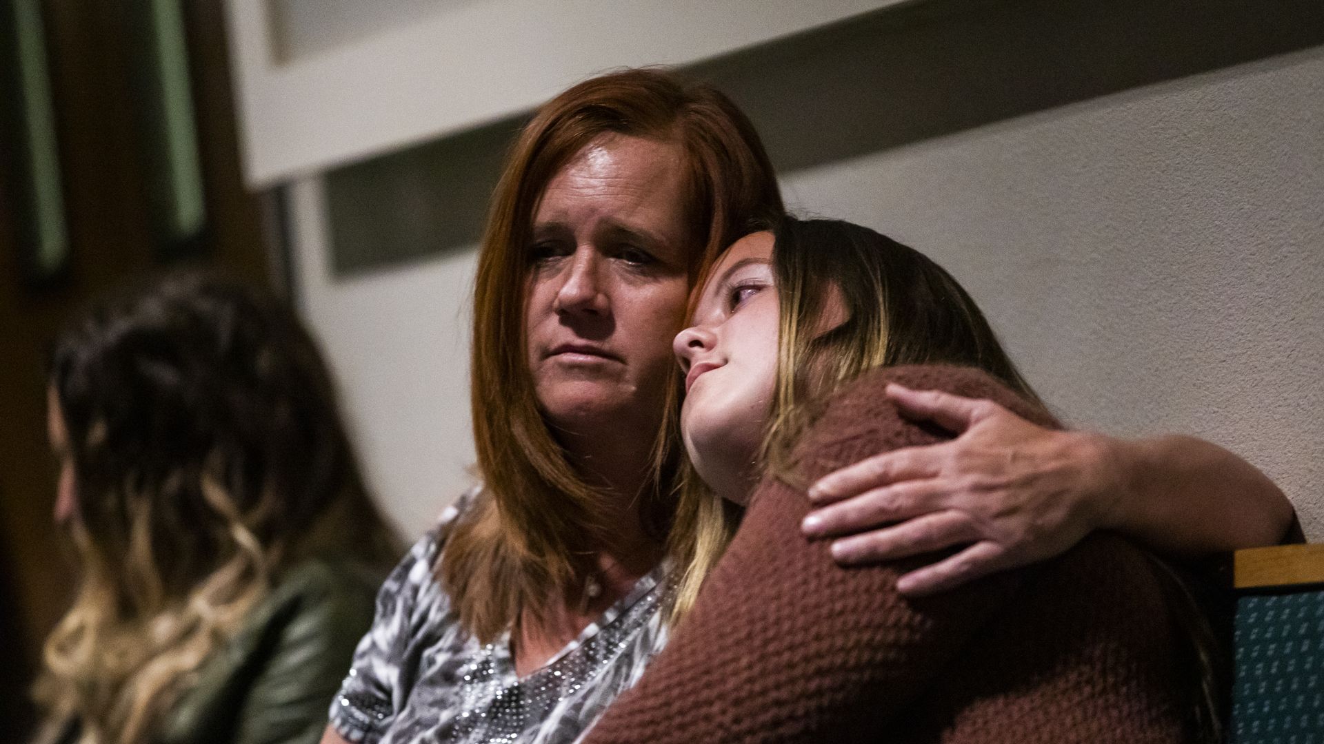 Photo of woman with her 13 year old daughter at a commemoration ceremony for one year after Paradise fire