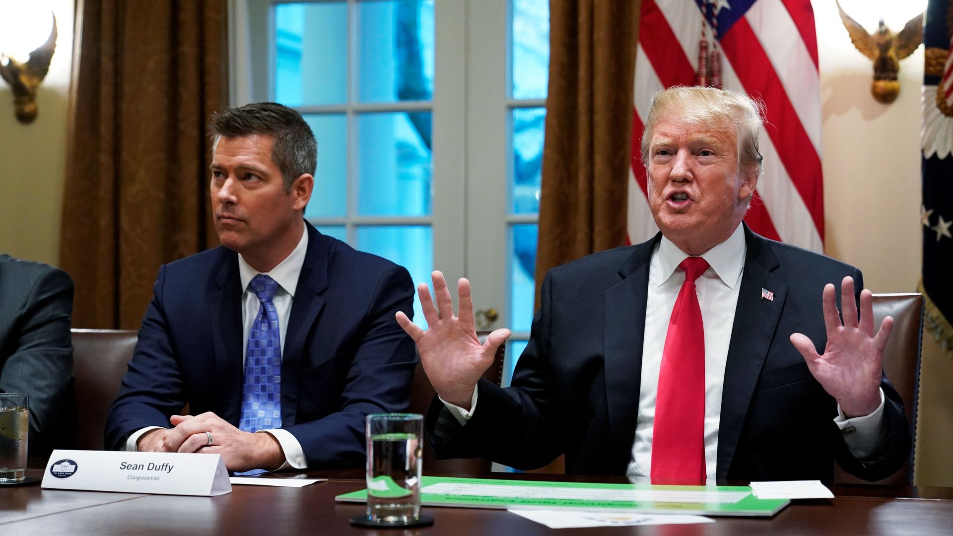 Trump, with US Congressman Sean Duffy (L), speaks in the Cabinet Room of the White House on January 24, 2019. - Trump spoke about the unfair trade practices at play in the world. (Photo by MANDEL NGAN / AFP) (Photo credit should read MANDEL NGAN/AFP via Getty Images)