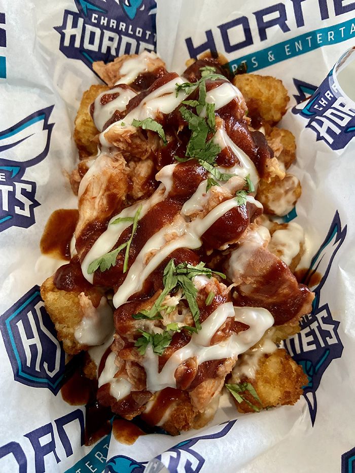Loaded tater tots with pulled chicken or pulled pork. Photo: Ashley Mahoney/Axios 