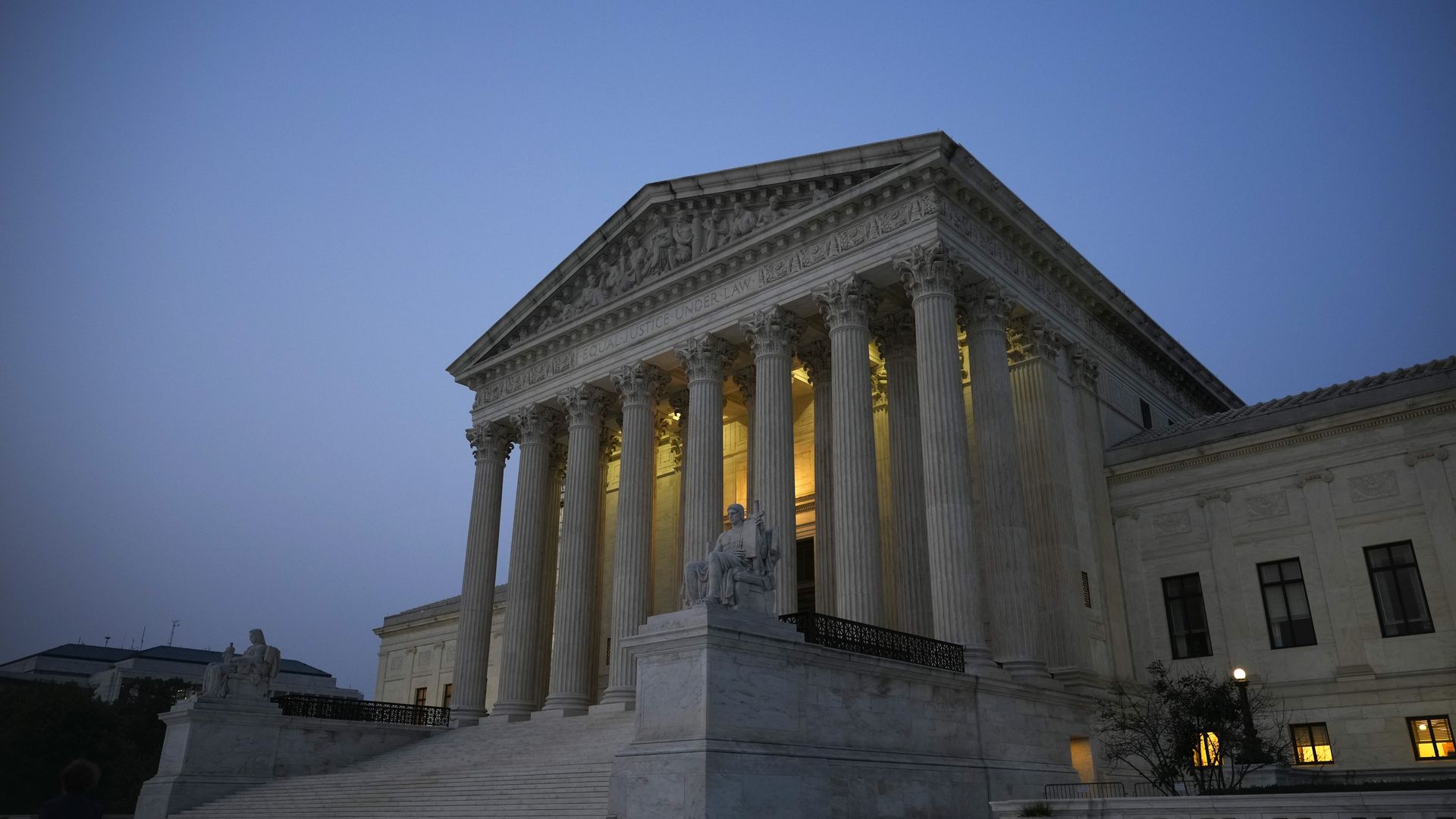 An image of the front of the Supreme Court with a blue sky