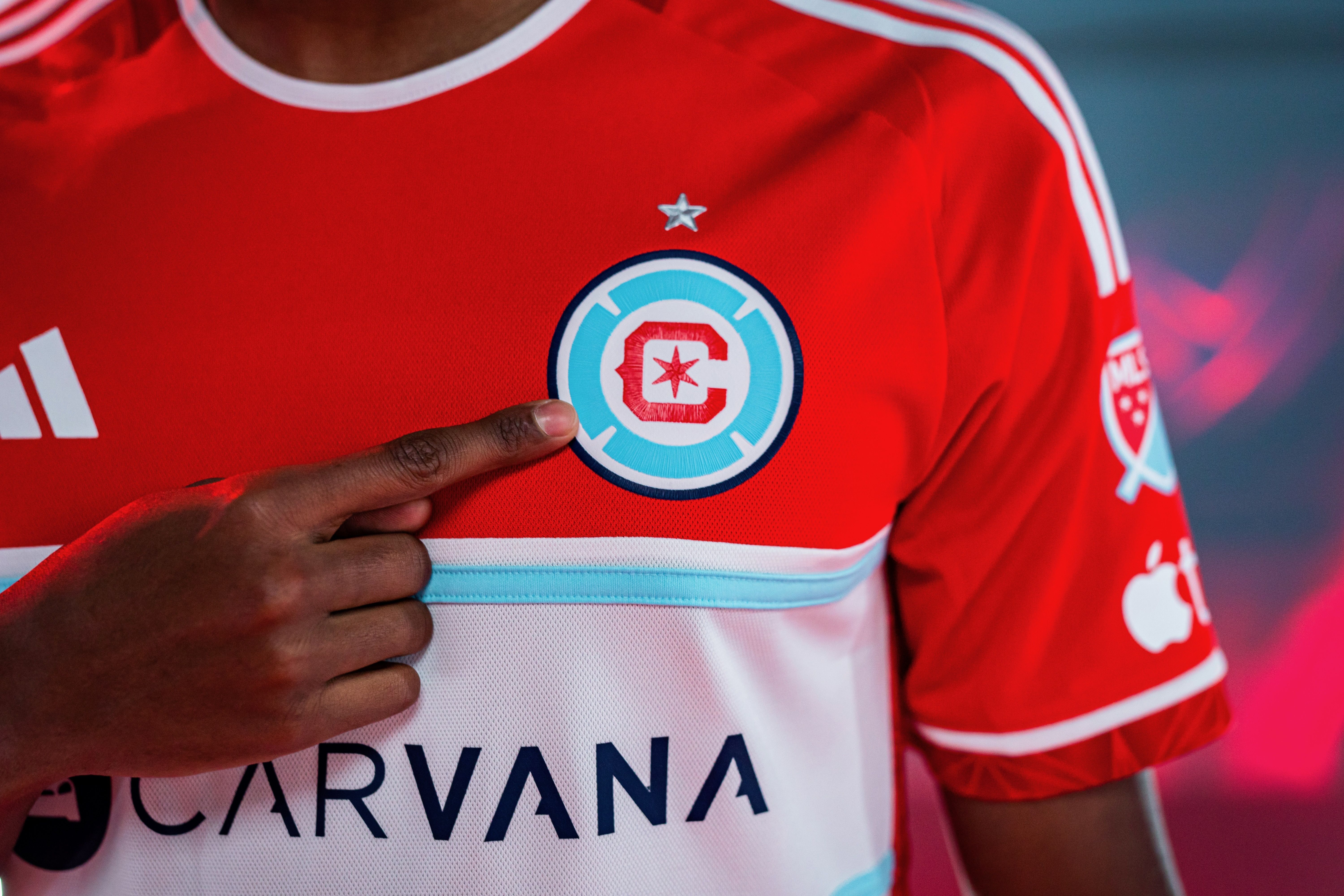 Photo of a man in a jersey 