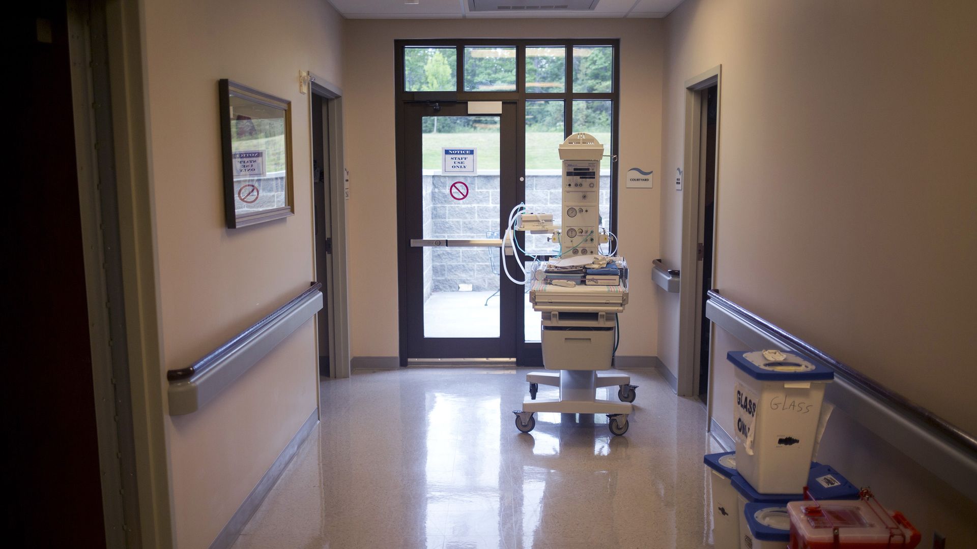 A hospital hallway with machines.