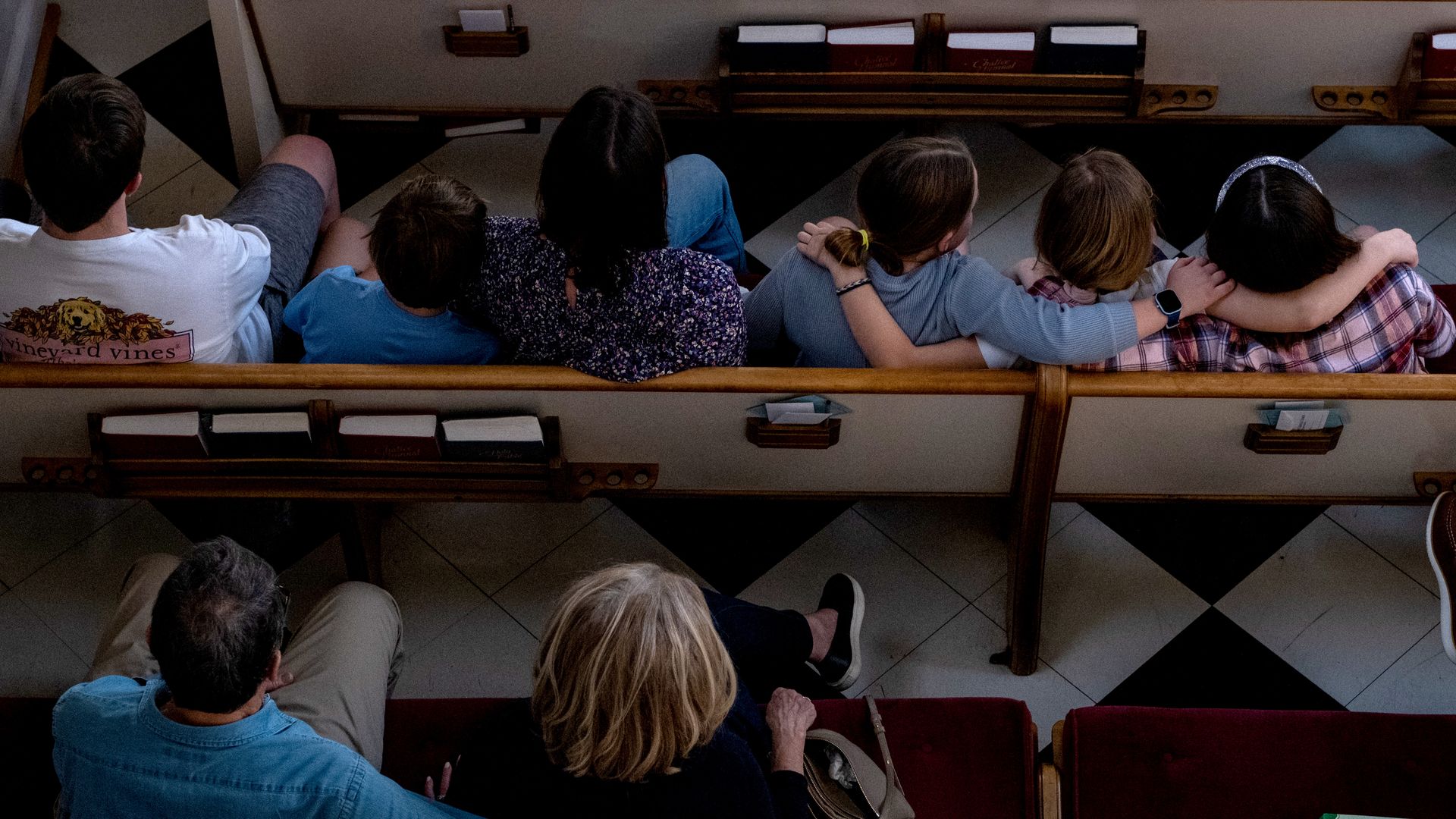 Mourners in pews.
