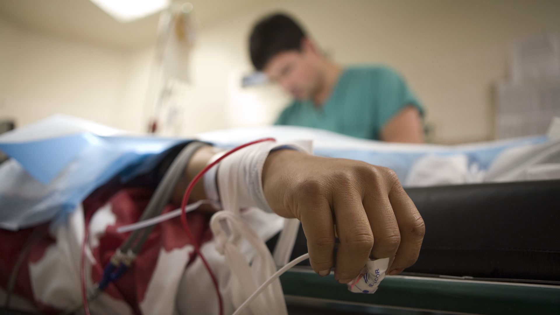 A patient is treated in a hospital's emergency room.