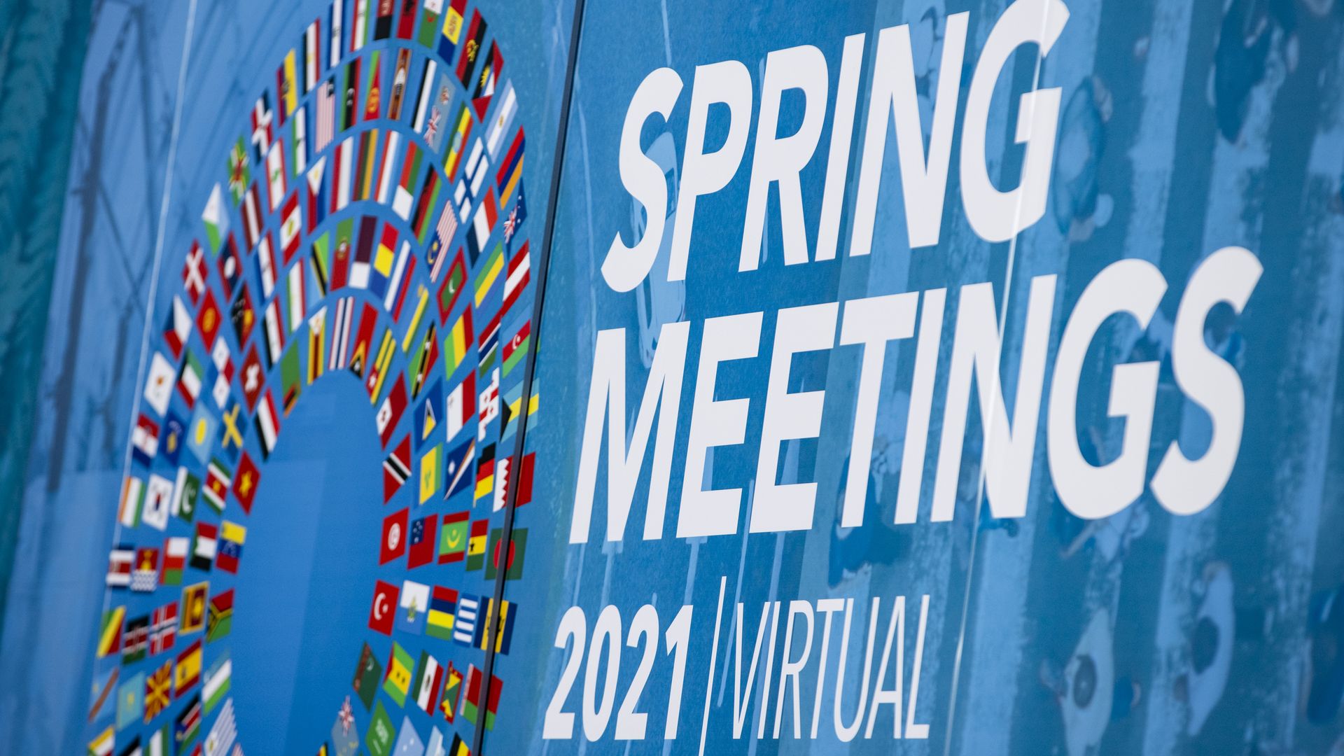 A photo of a sign for the International Monetary Fund (IMF) and World Bank spring meetings signage at the IMF headquarters in Washington, D.C.