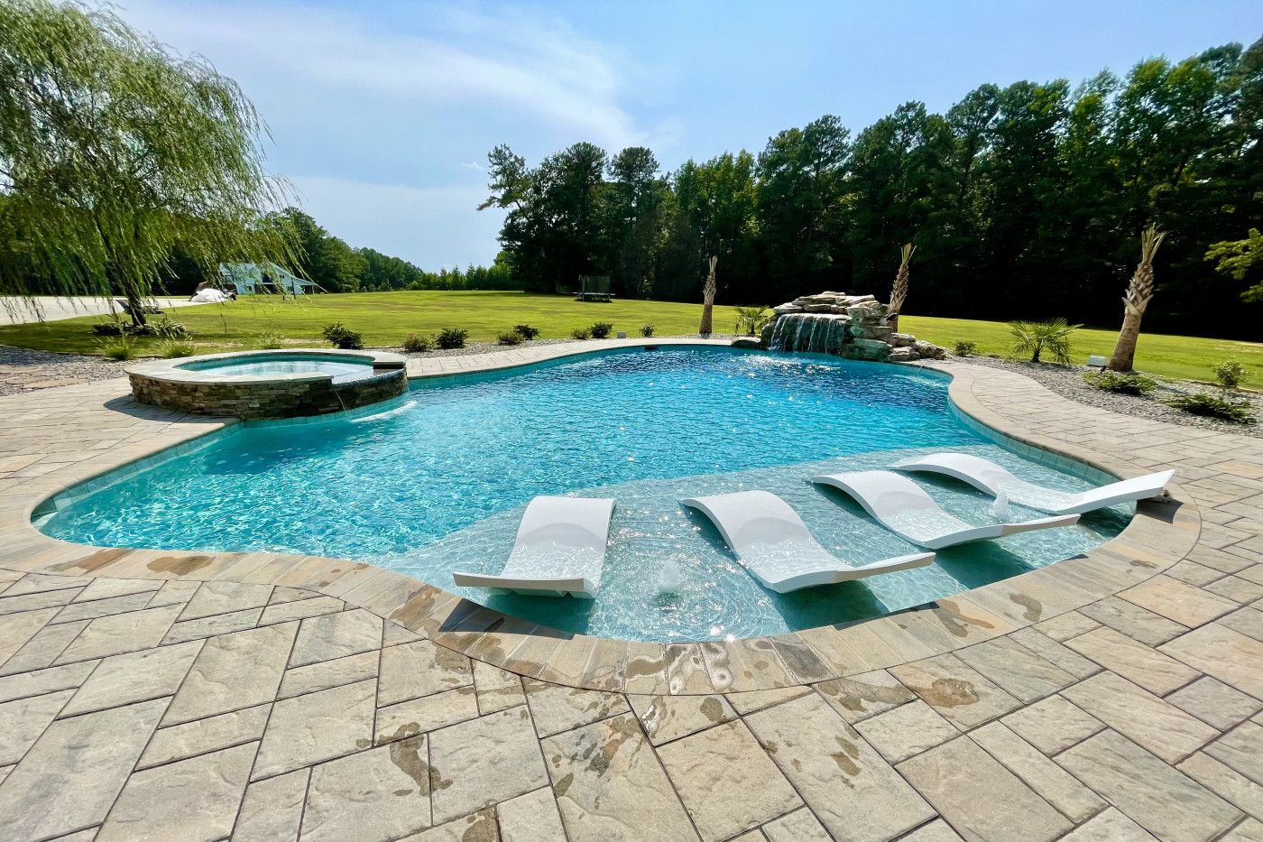 Secluded Resort-Style Pool lounge chairs in the water
