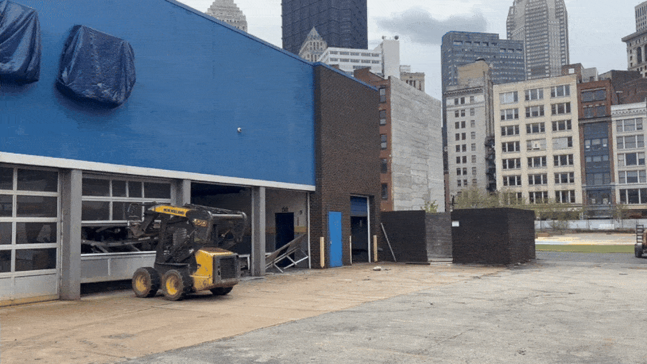 A forklift starting demolition of the Goodyear building at Arts Landing park in Downtown Pittsburgh on April 21, 2025
