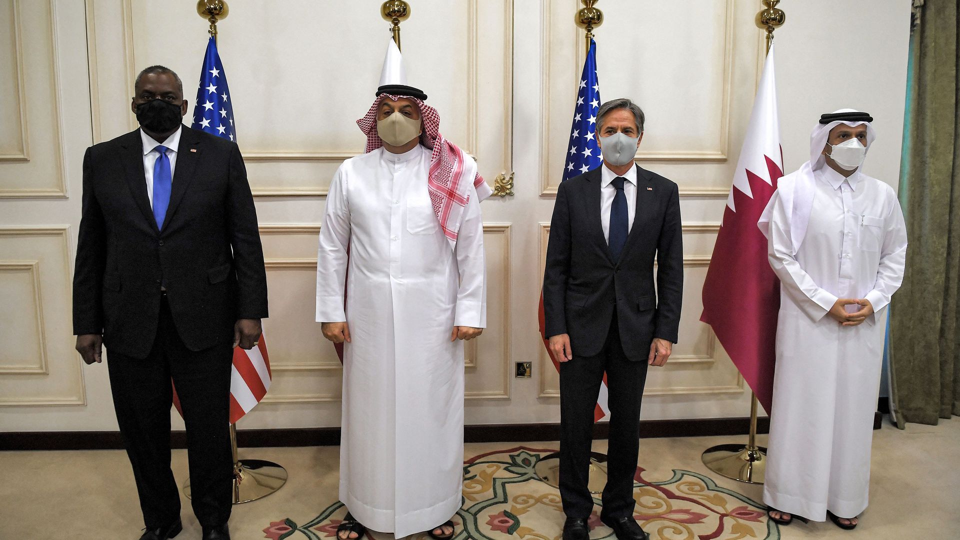 Blinken (2nd-R) and Austin (L) with their Qatari counterparts Mohammed bin Abdulrahman Al Thani (R) and Khalid bin Mohammed Al-Attiyah.
