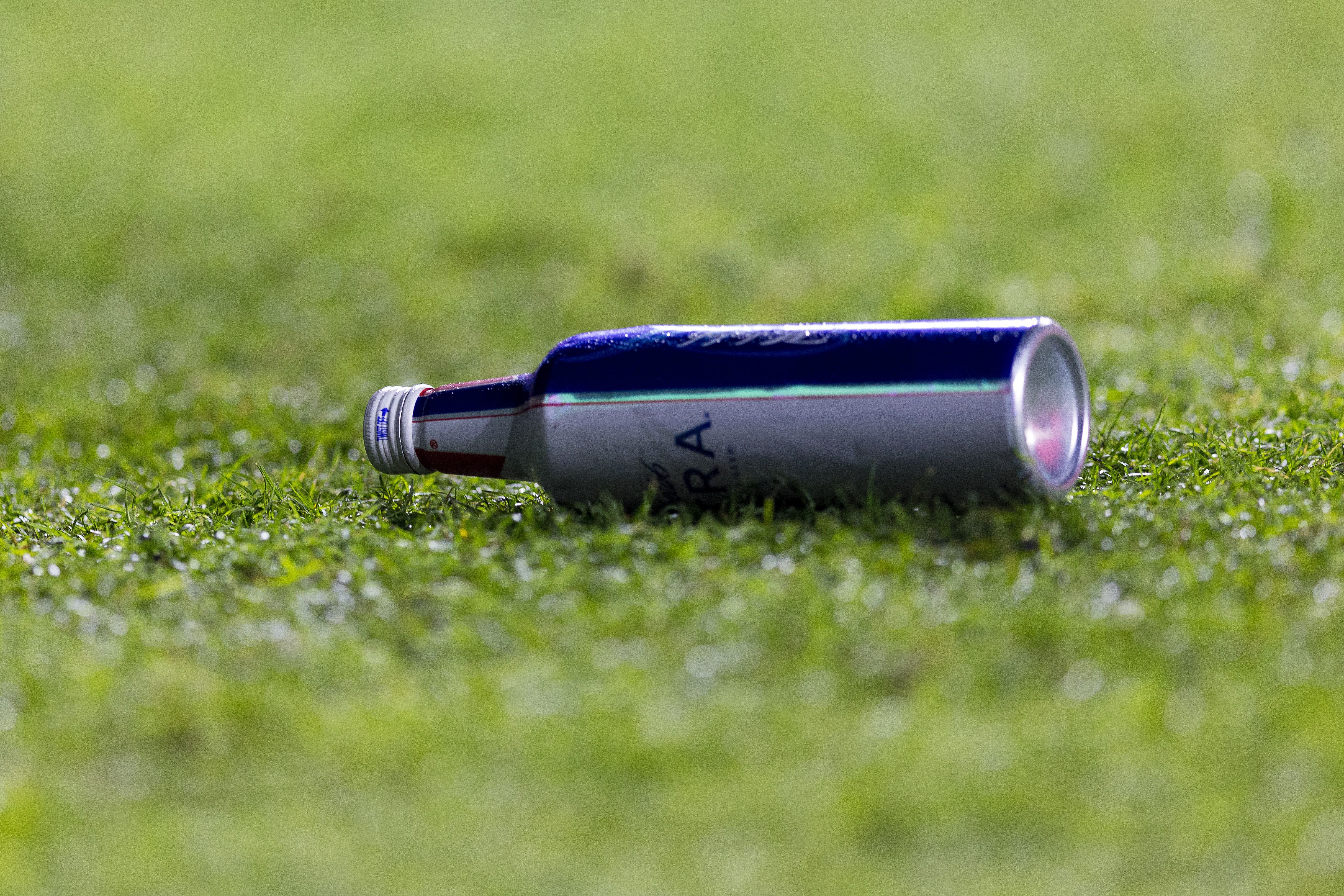 Photo shows a metal beer bottle on the field at Tiger Stadium.