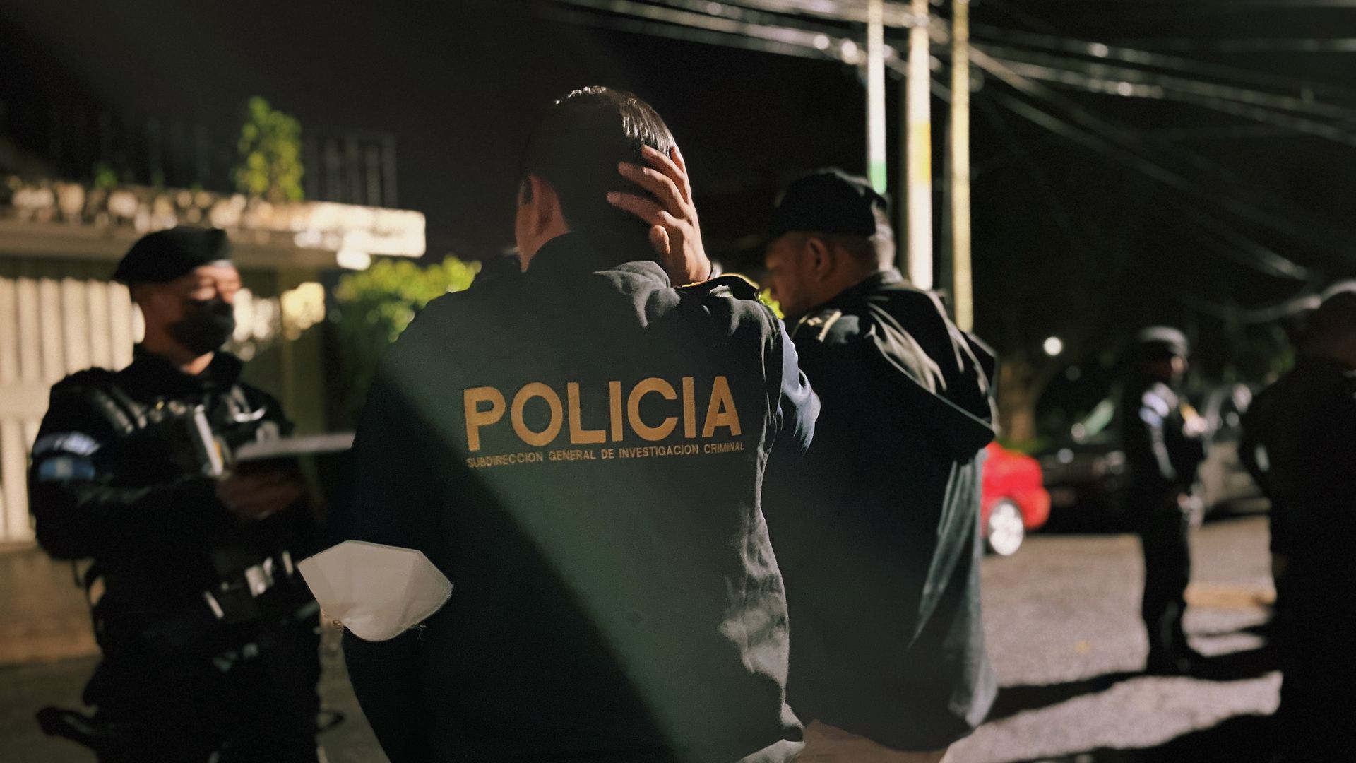 Guatemalan law enforcement prepare for an early morning search warrant execution. Photo: Stef Kight/Axios