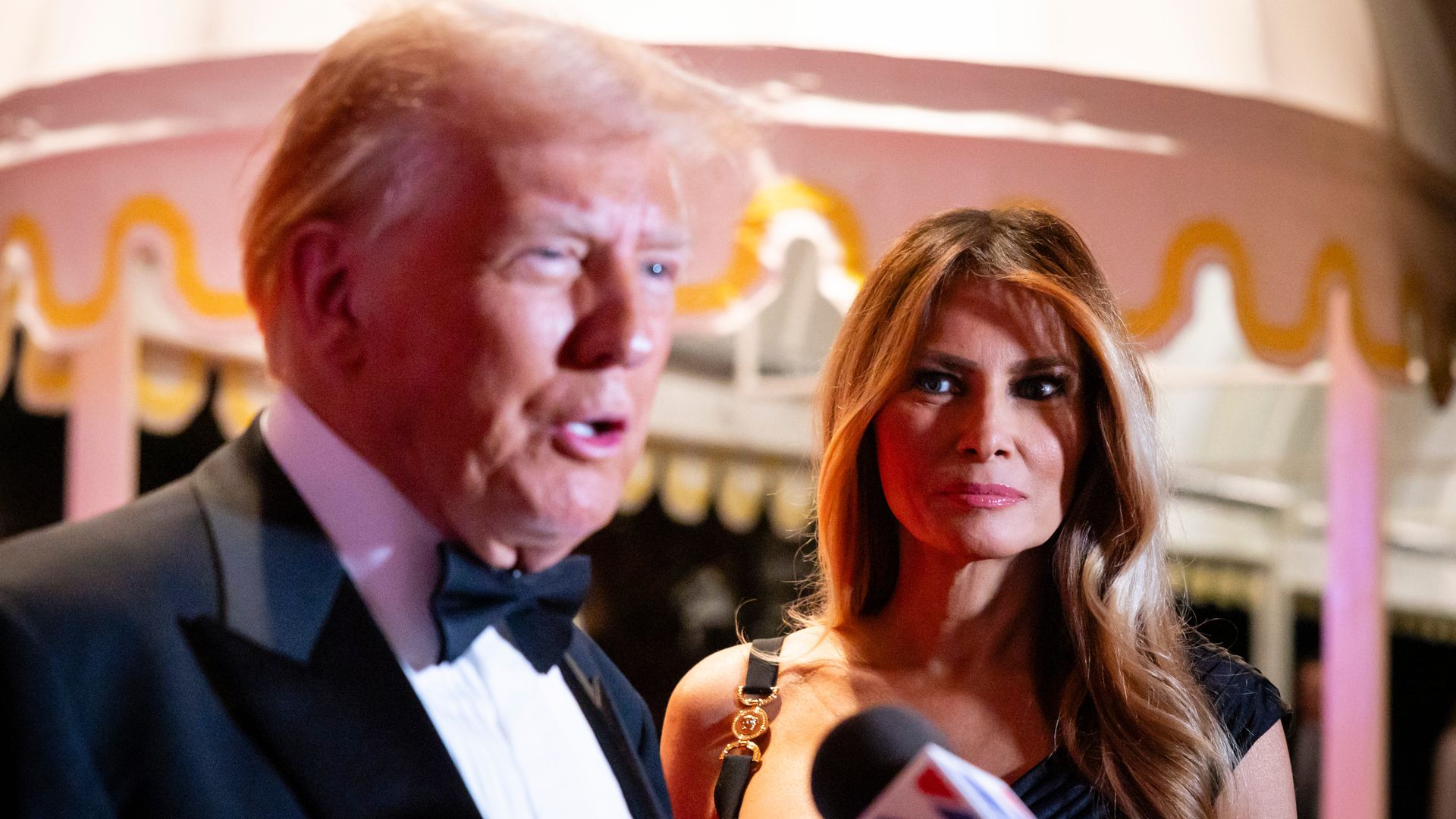 Melania Trump watches President-elect Trump speak at a New Year's Eve event.