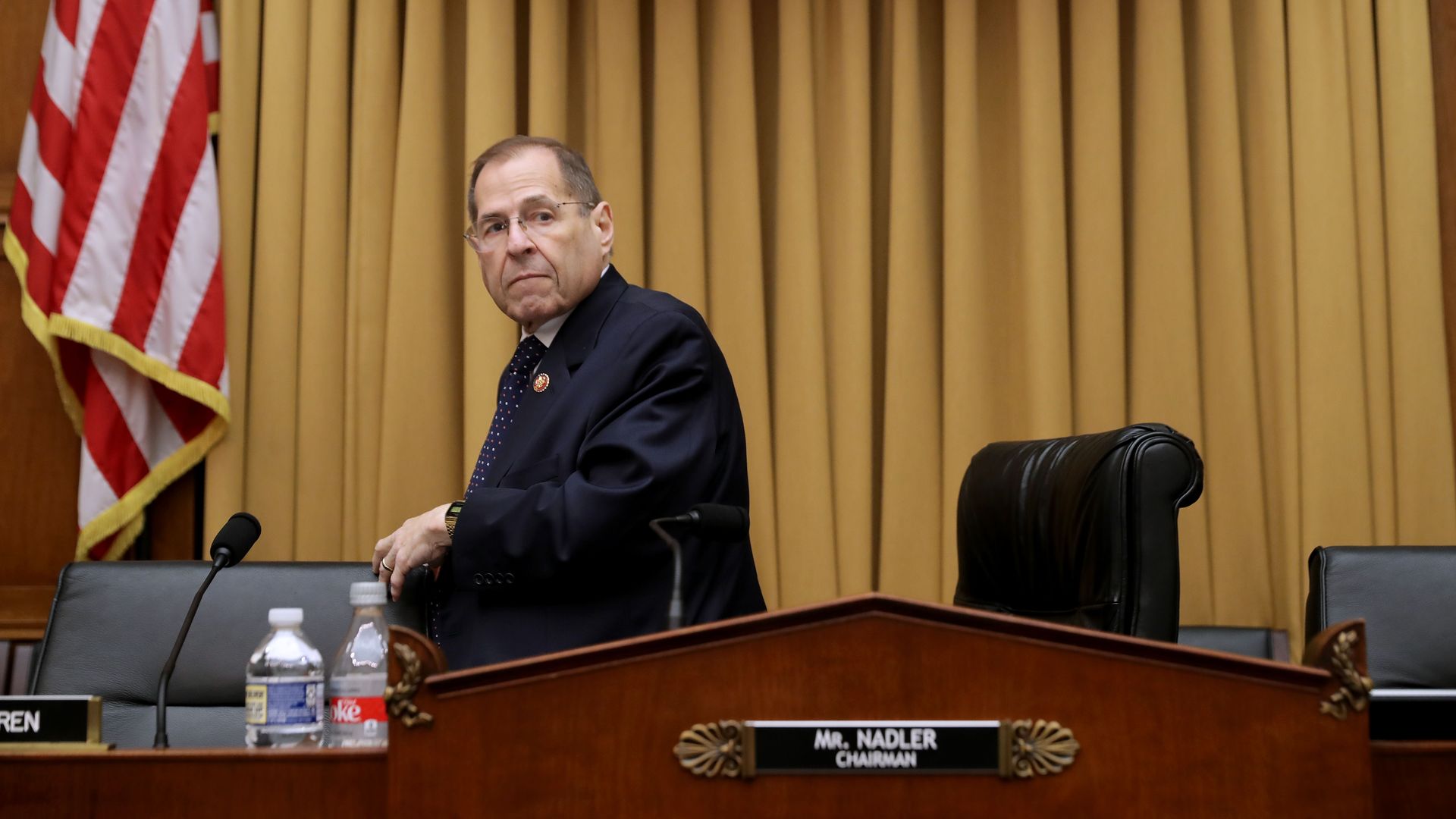 In this image, Nadler stands from his seat.