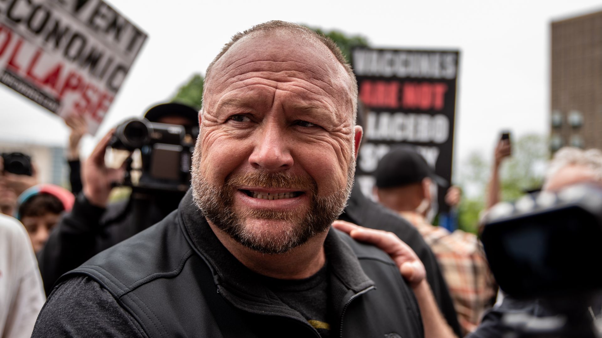 Infowars founder Alex Jones interacts with supporters at the Texas State Capital building on April 18, 2020 in Austin, Texas. 