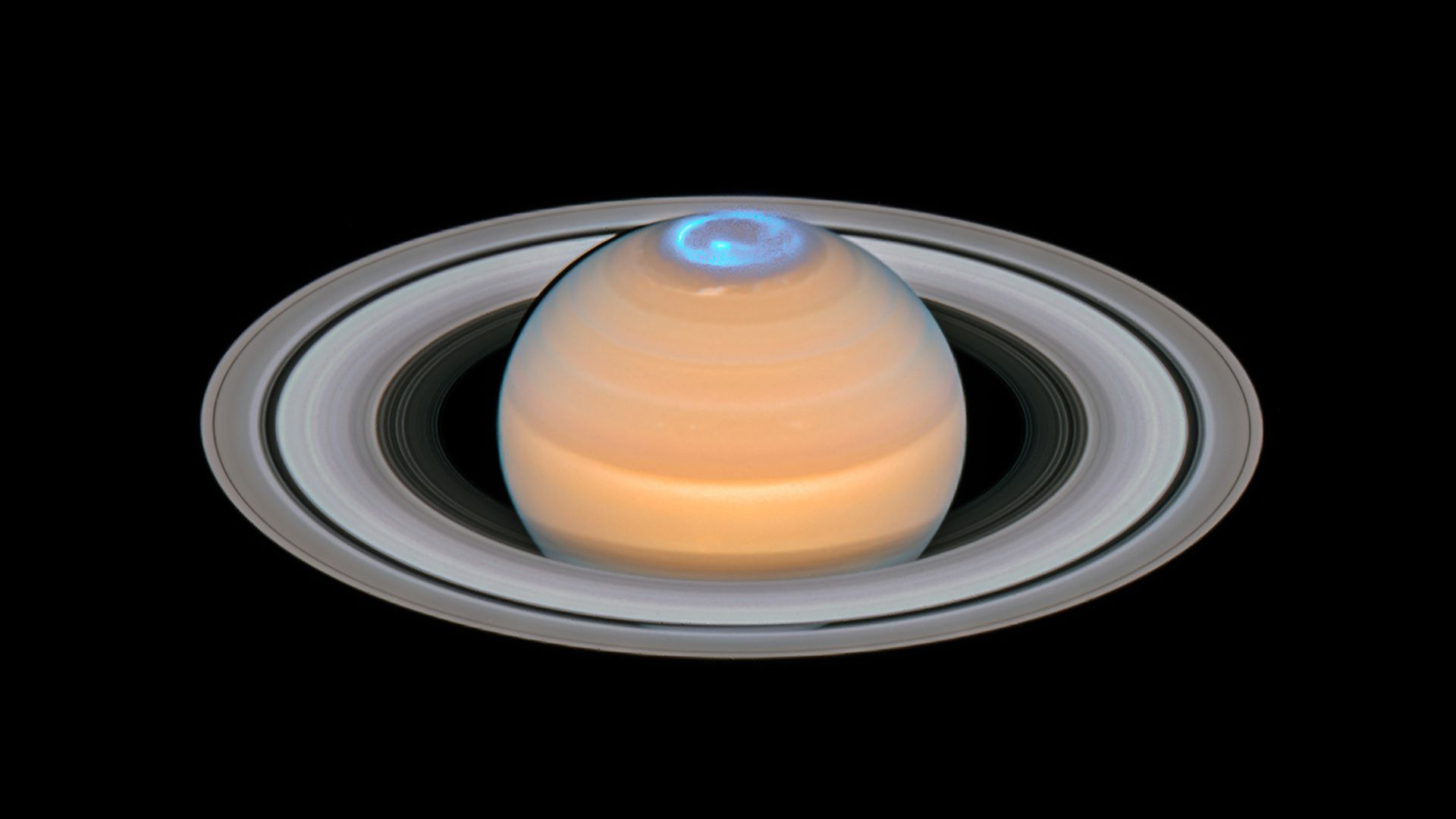A composite of observations made of Saturn in early 2018 in the optical and of the auroras on Saturn’s north pole region, made in 2017.