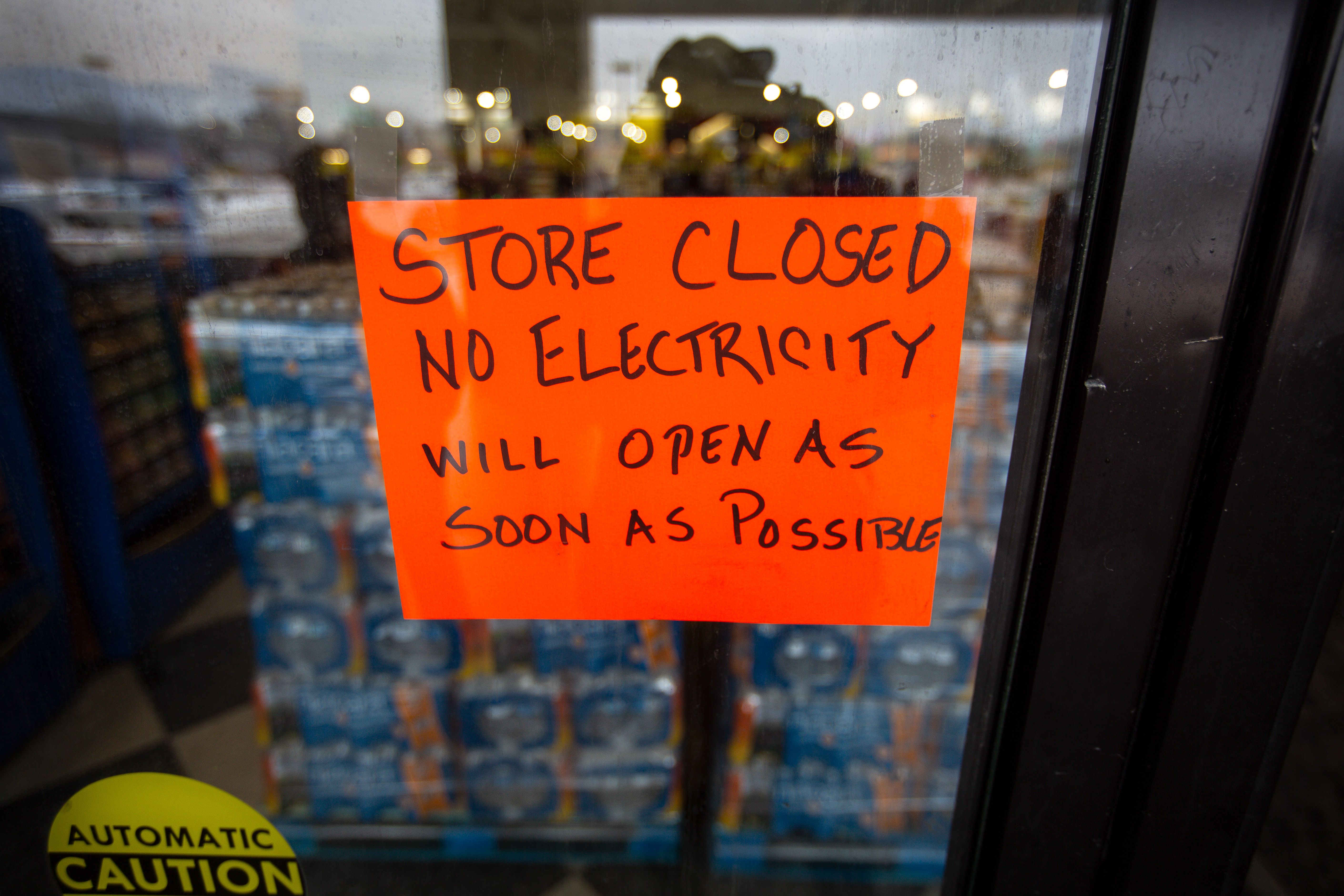  A sign states that a Fiesta Mart is closed because of a power outage in Austin, Texas on February 17
