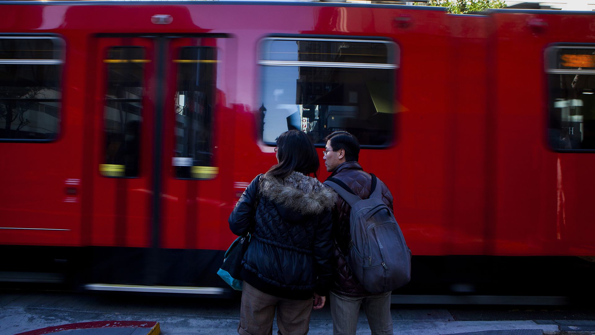 Passengers waiting to board the San Diego Trolley
