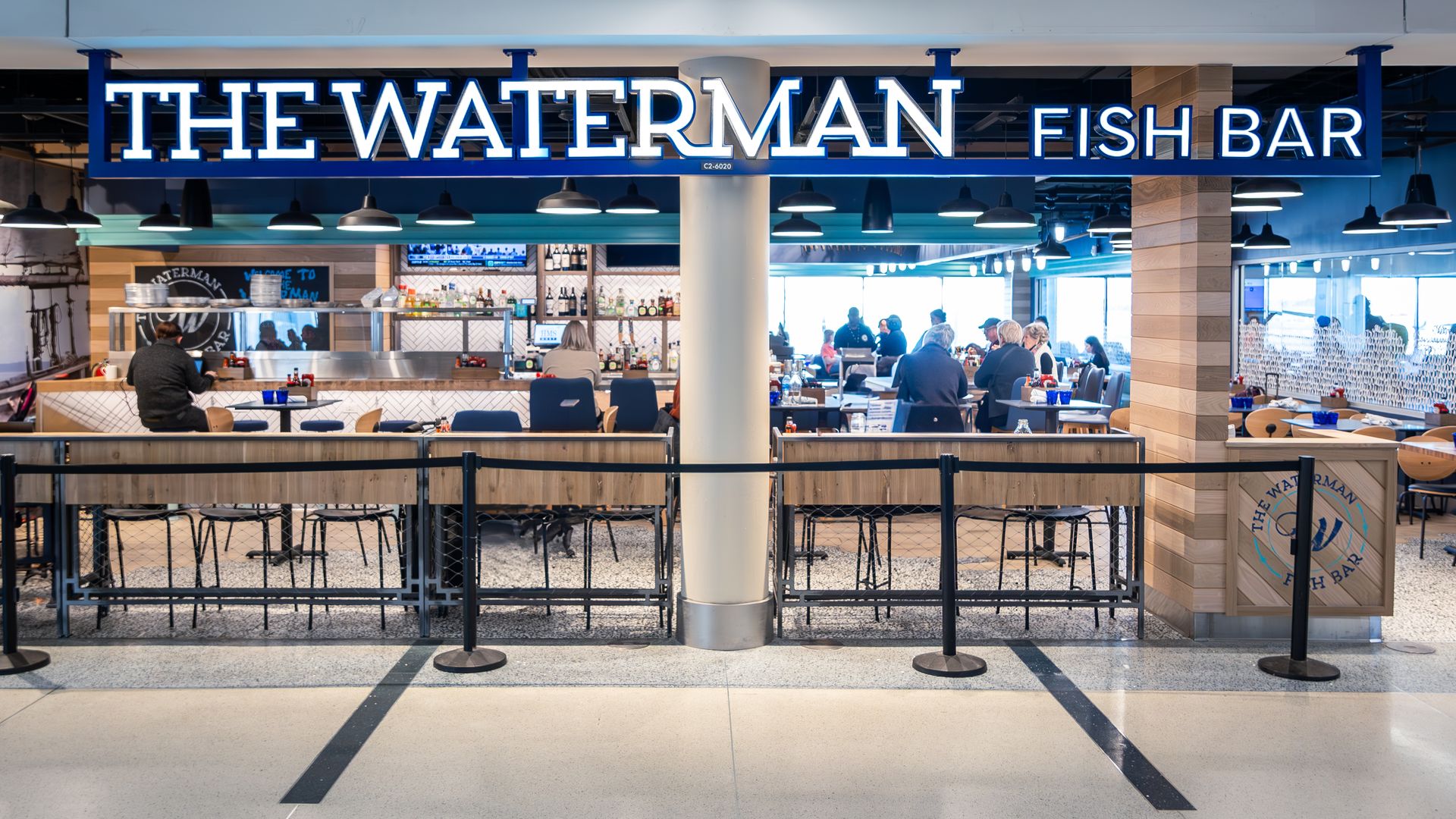 "The Waterman Fish Bar" sign at Charlotte Douglas International Airport. 