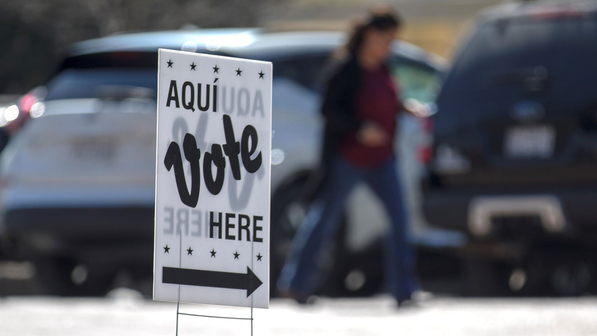 A vote here sign in a parking lot