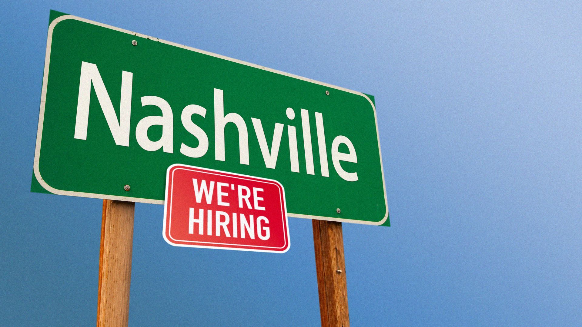 Nashville road sign with a "we're hiring" sign.