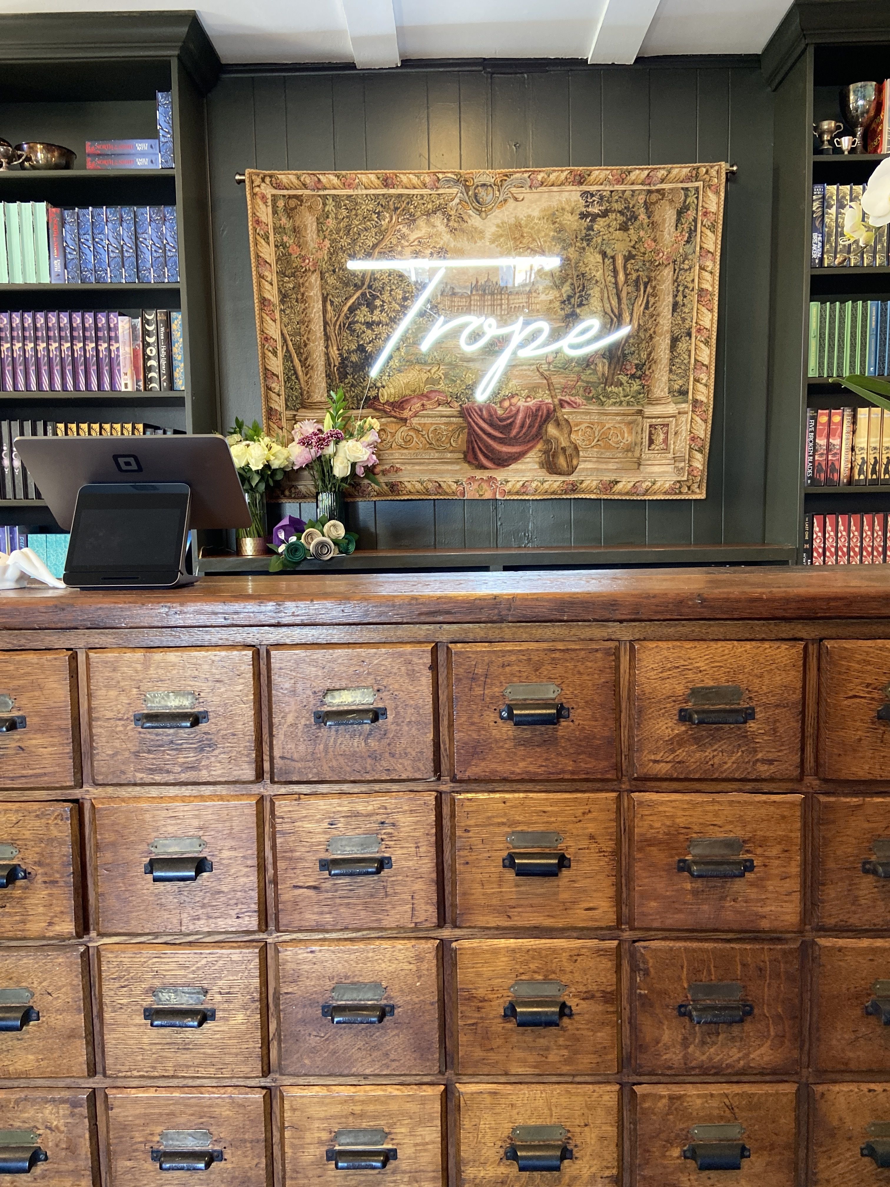 Trope sign behind the counter.