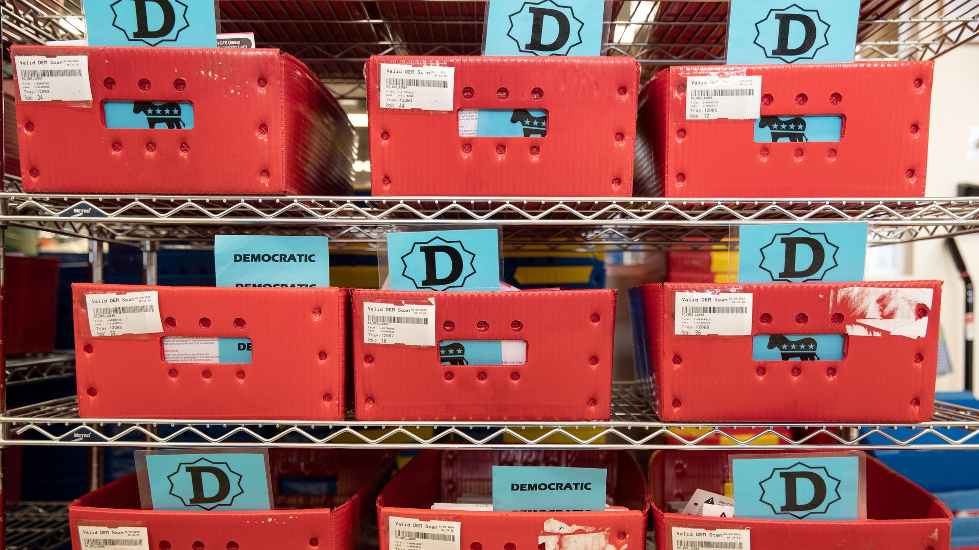 Red trays filled with mail-in primary ballots sit on shelves in Washington state.