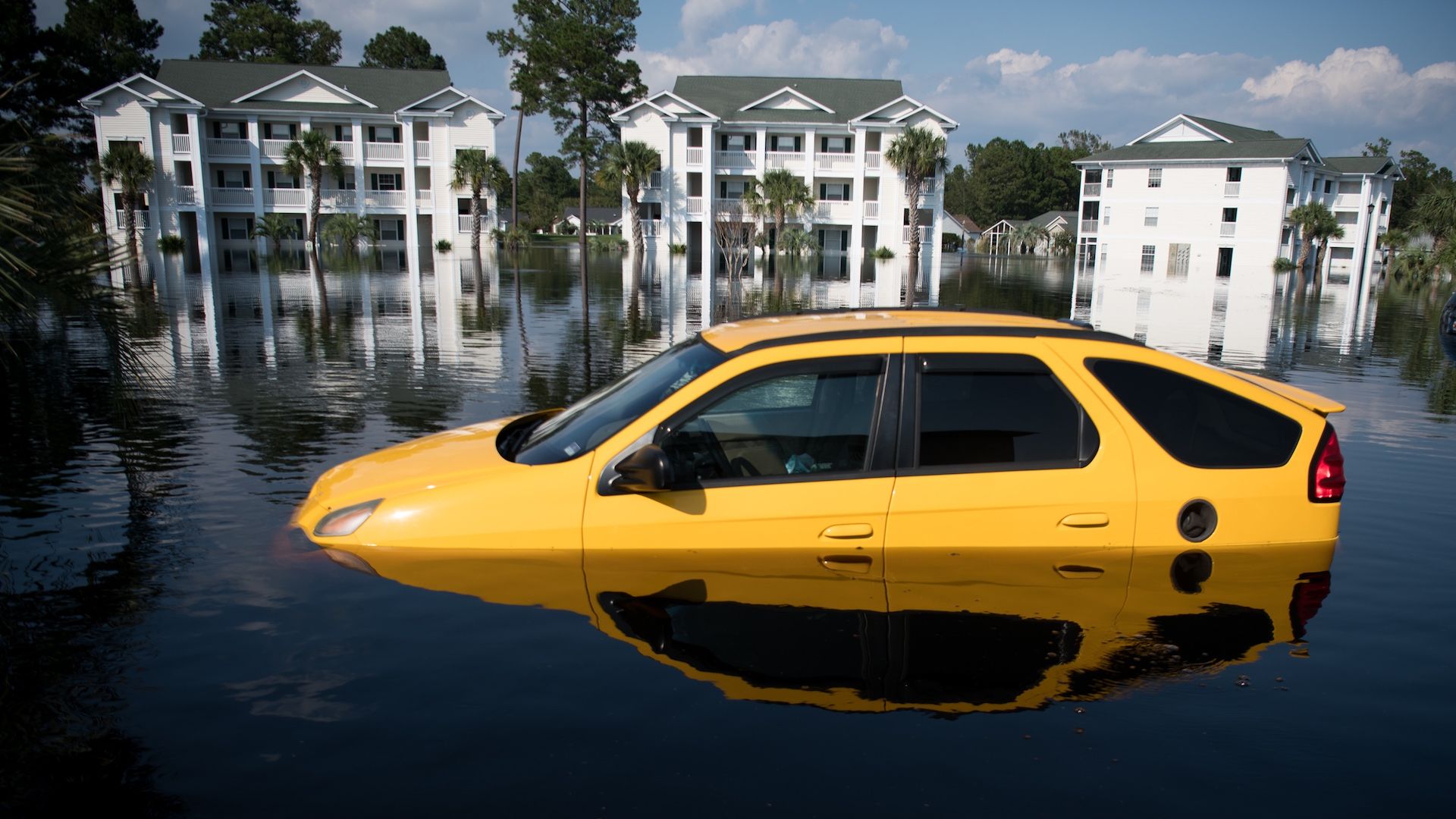 A car is inundated with floodwaters caused by Hurricane Florence at an apartment complex at Aberdeen Country Club on September 20, 2018 in Longs, South Carolina. 
