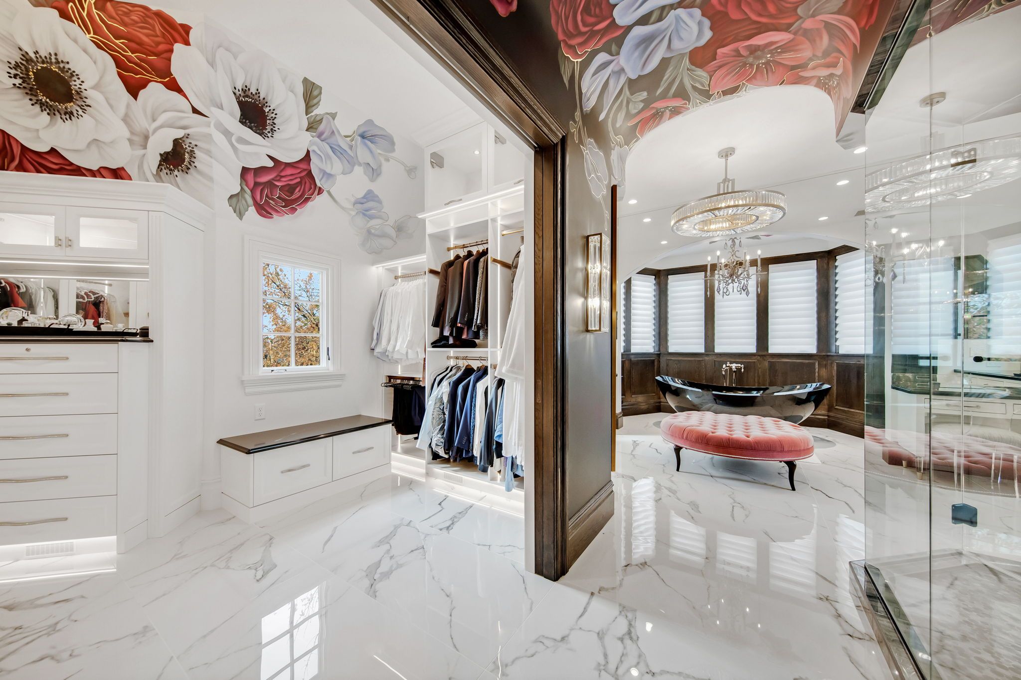A white bathroom with floral wallpaper on the ceiling.
