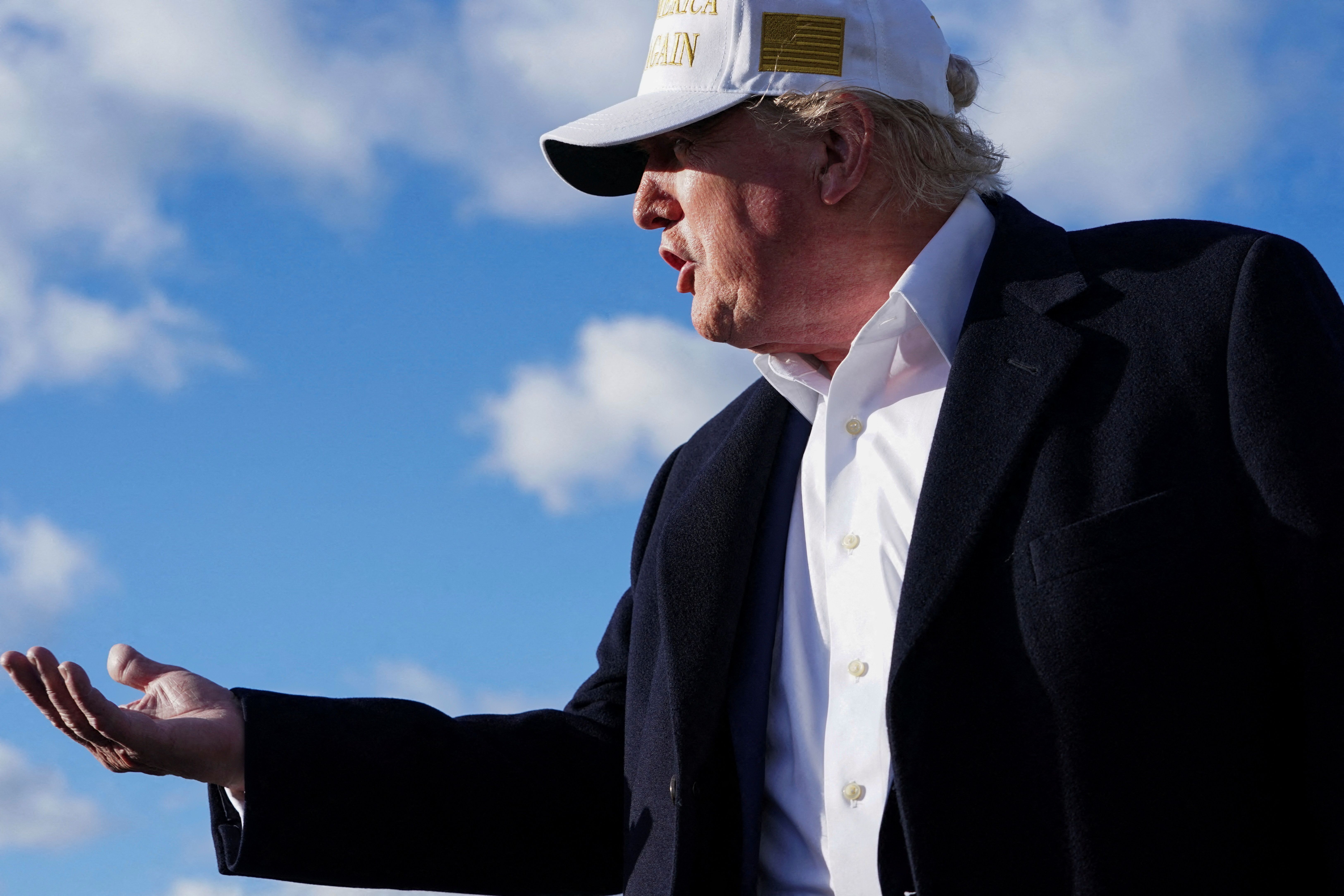 President Trump speaks to the media on Sunday before boarding Air Force One in Morristown, N.J. Photo: Nathan Howard/Reuters