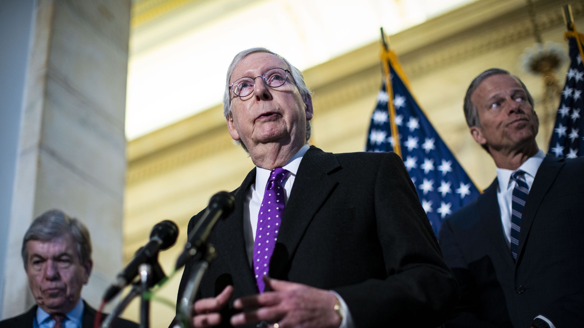 Senate Minority Leader Mitch McConnell speaks to members of the media during a news conference.
