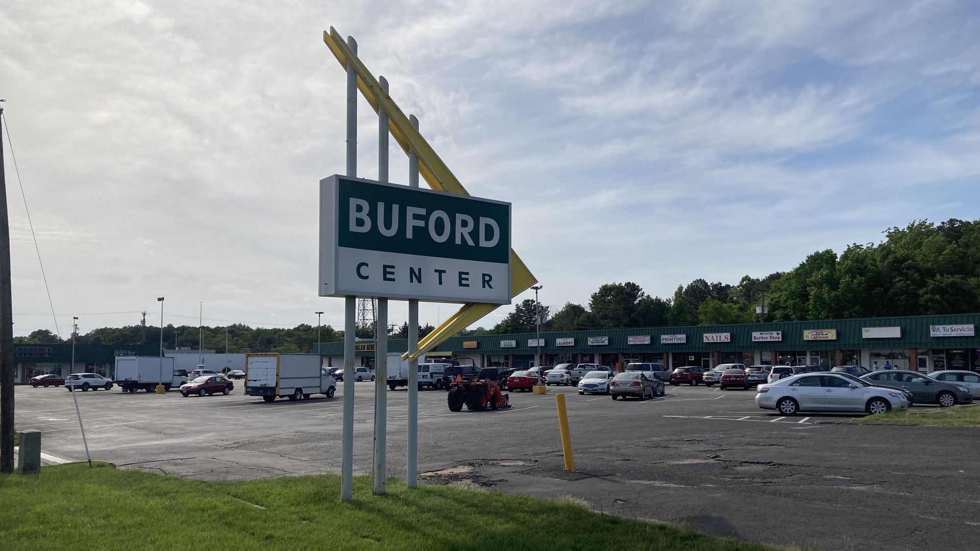 A very old looking shopping center that says Burford Center 