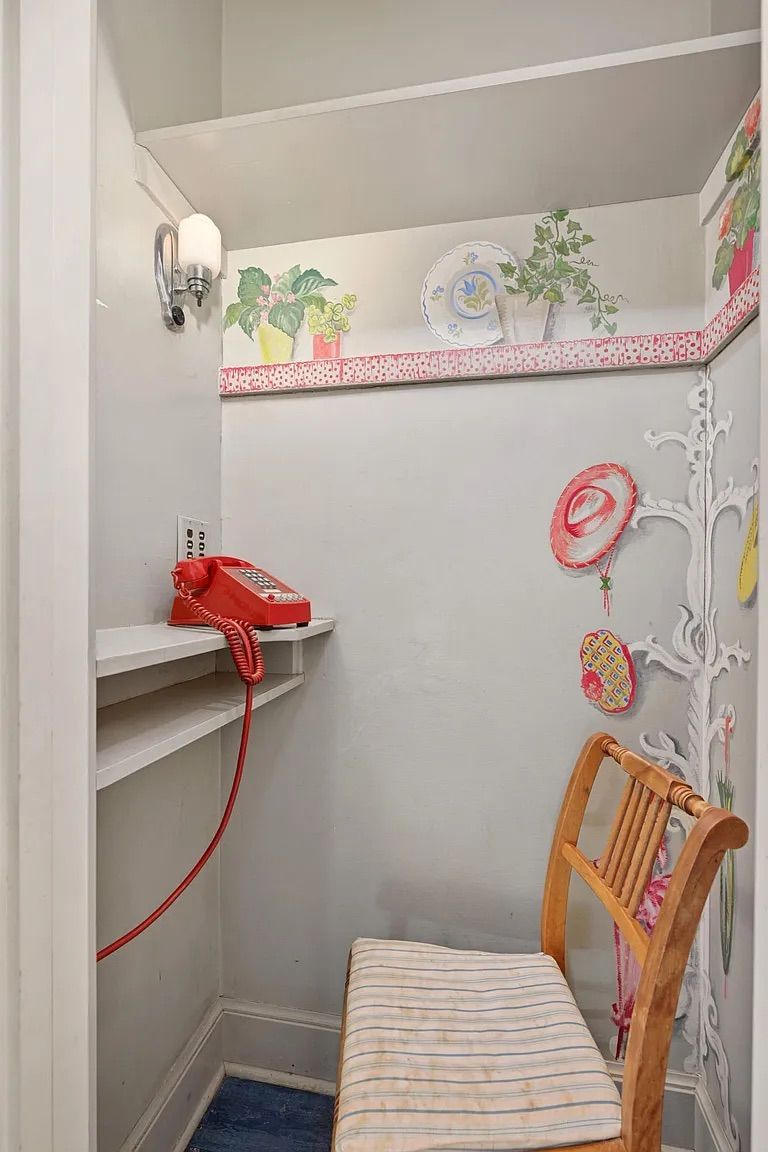 A small room with a phone inside.