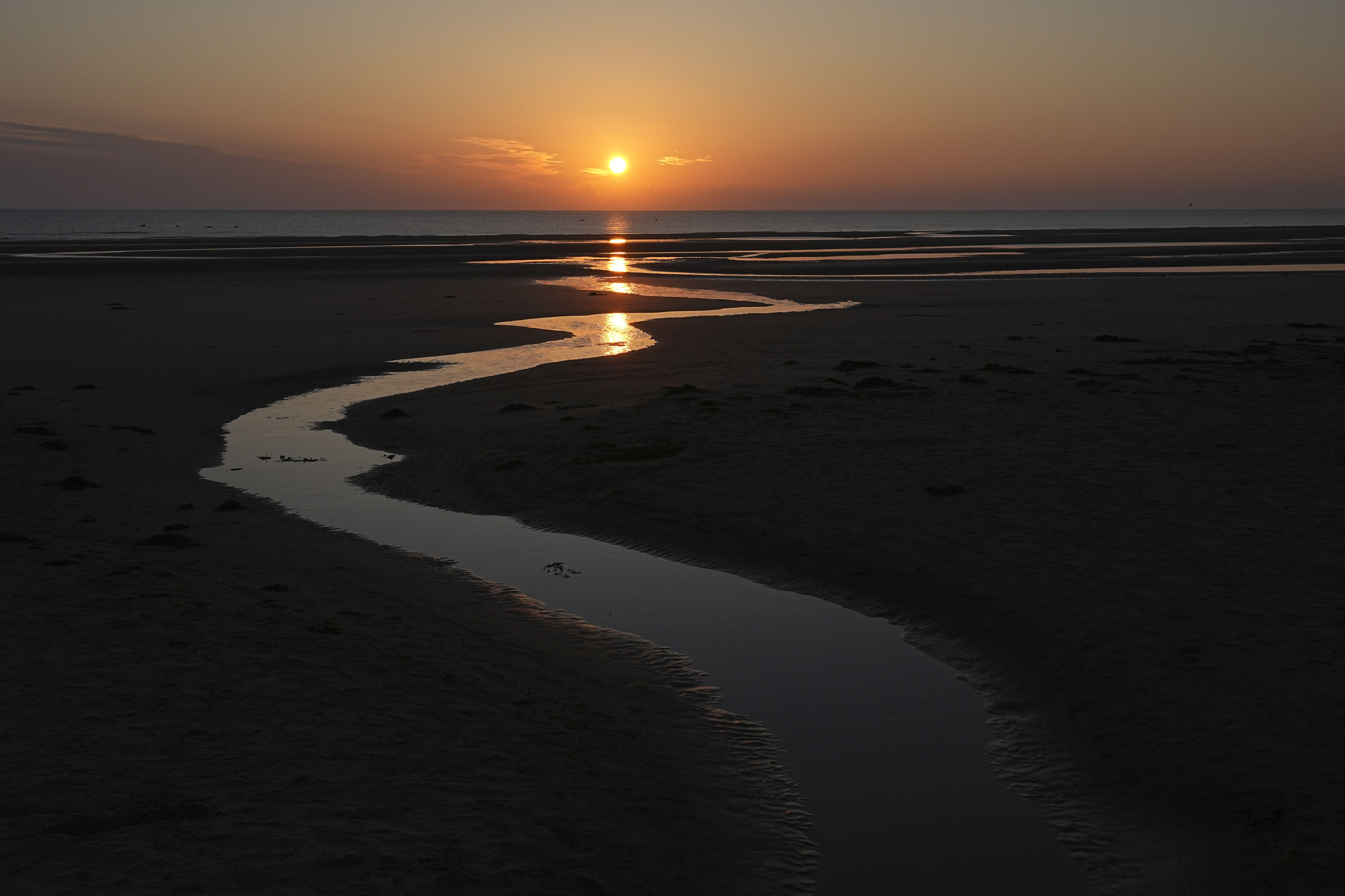 Sun rises over Omaha Beach near Colleville-sur-Mer Normandy, Thursday, June 6, 2024. World War II veterans from across the United States as well as Britain and Canada are in Normandy this week to mark 80 years since the D-Day landings that helped lead to Hitler's defeat